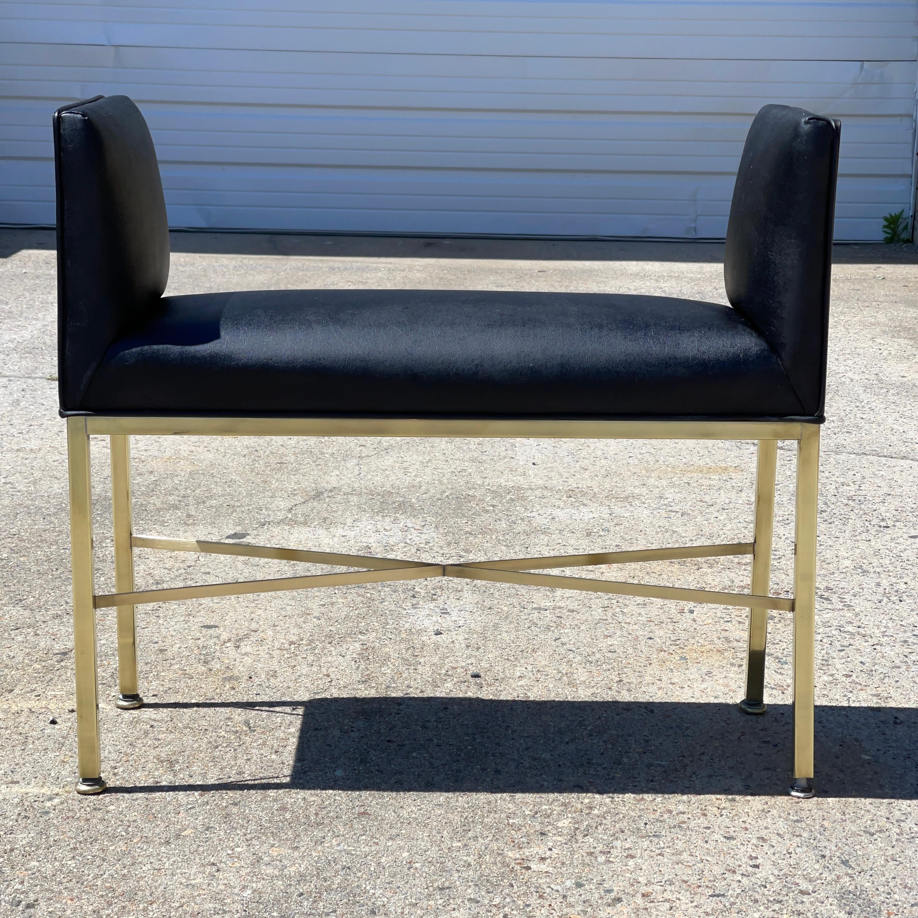 Solid brass square bar x-form bench seat by Paul McCobb for Calvin Furniture with black leatherette upholstered seat with raised sides and inset brass trimmed handles. 26