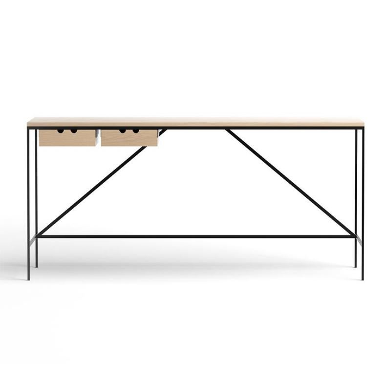 Console with two drawers designed by Paul McCobb in 1952. 

The foundation of the Cache series, part of Paul McCobb’s extensive Planner series, is a beautifully simplistic and easy table with slim and straight steel legs, stripped from any details