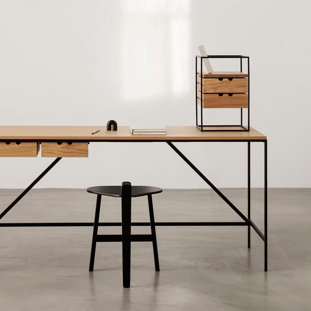 Table designed by Paul McCobb in 1952. 

The foundation of the Cache series, part of Paul McCobb’s extensive Planner series, is a beautifully simplistic and easy table with slim and straight steel legs, stripped from any details or ornament,