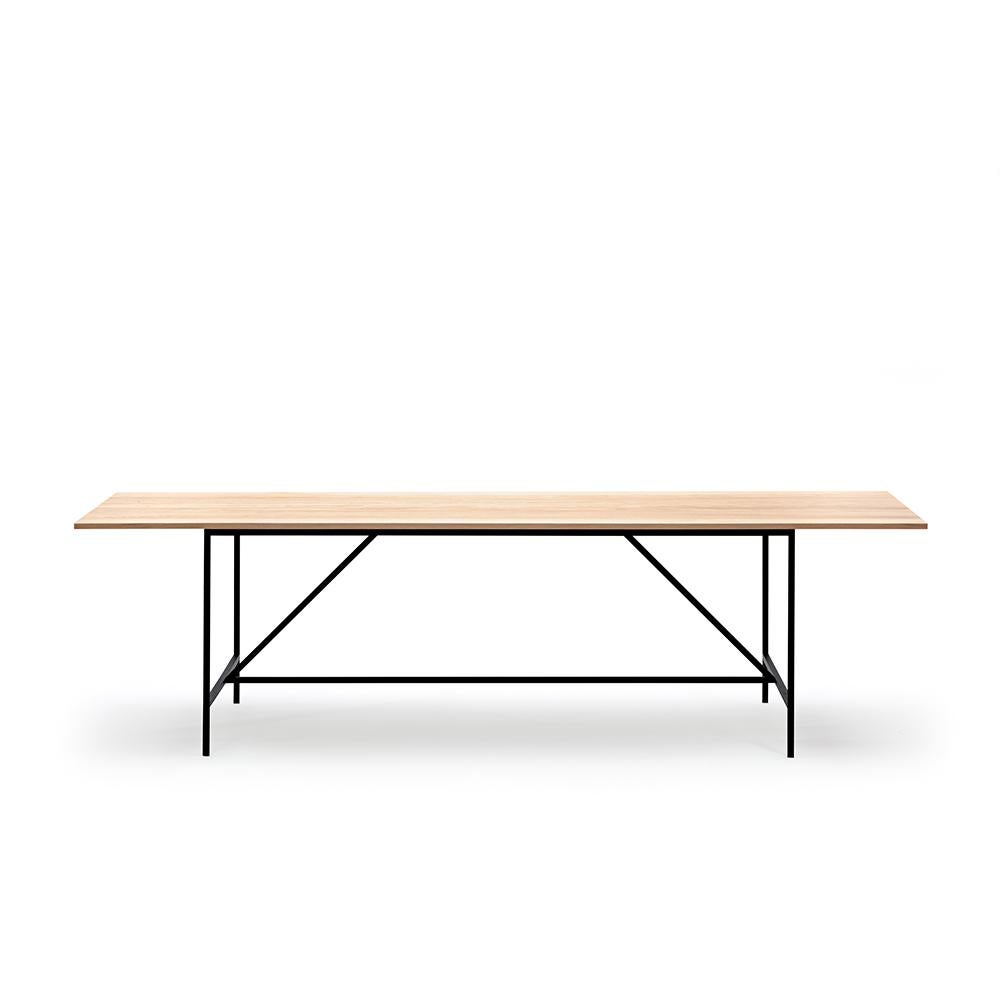 Table designed by Paul McCobb in 1952. 

The foundation of the Cache series, part of Paul McCobb’s extensive Planner series, is a beautifully simplistic and easy table with slim and straight steel legs, stripped from any details or ornament,