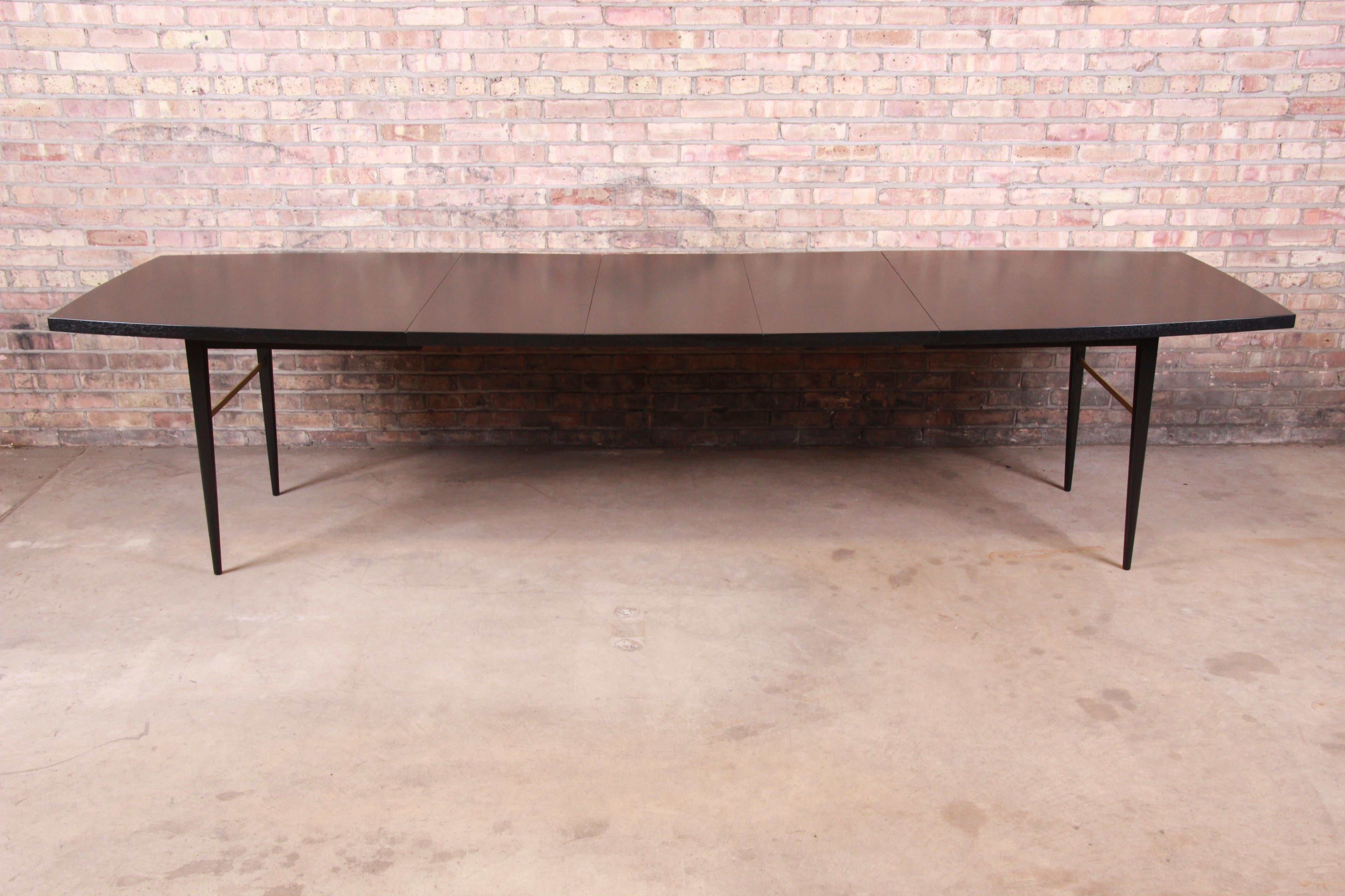 An exceptional Mid-Century Modern ebonized boat-shaped extension dining table

By Paul McCobb for Calvin Furniture 