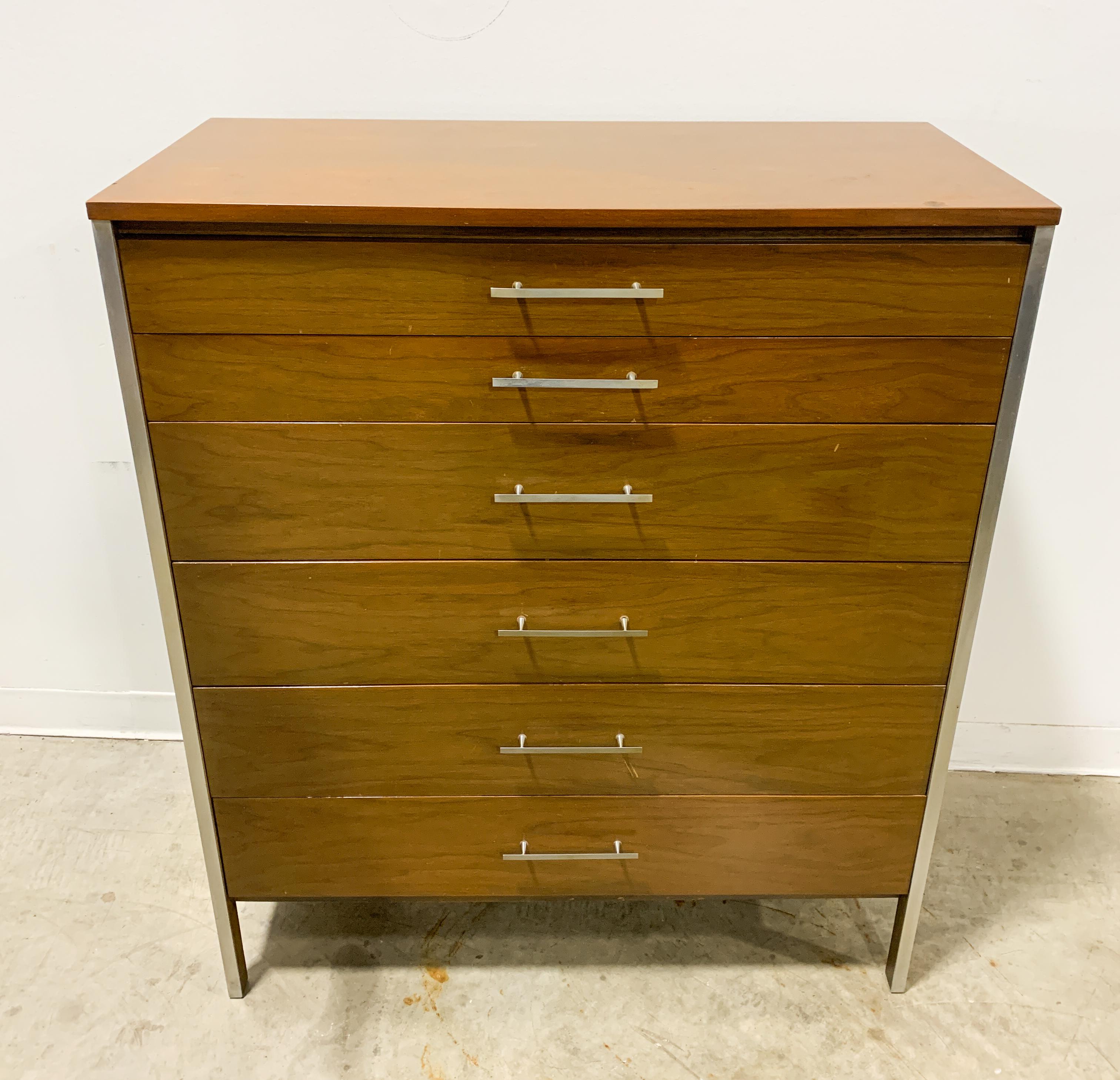 Tall dresser designed by Paul McCobb from the Linear line by Calvin Furniture. Walnut case with aluminum strips and cast aluminum pulls combine for a sharp modern look. This piece is in good original condition with occasional finish wear from age