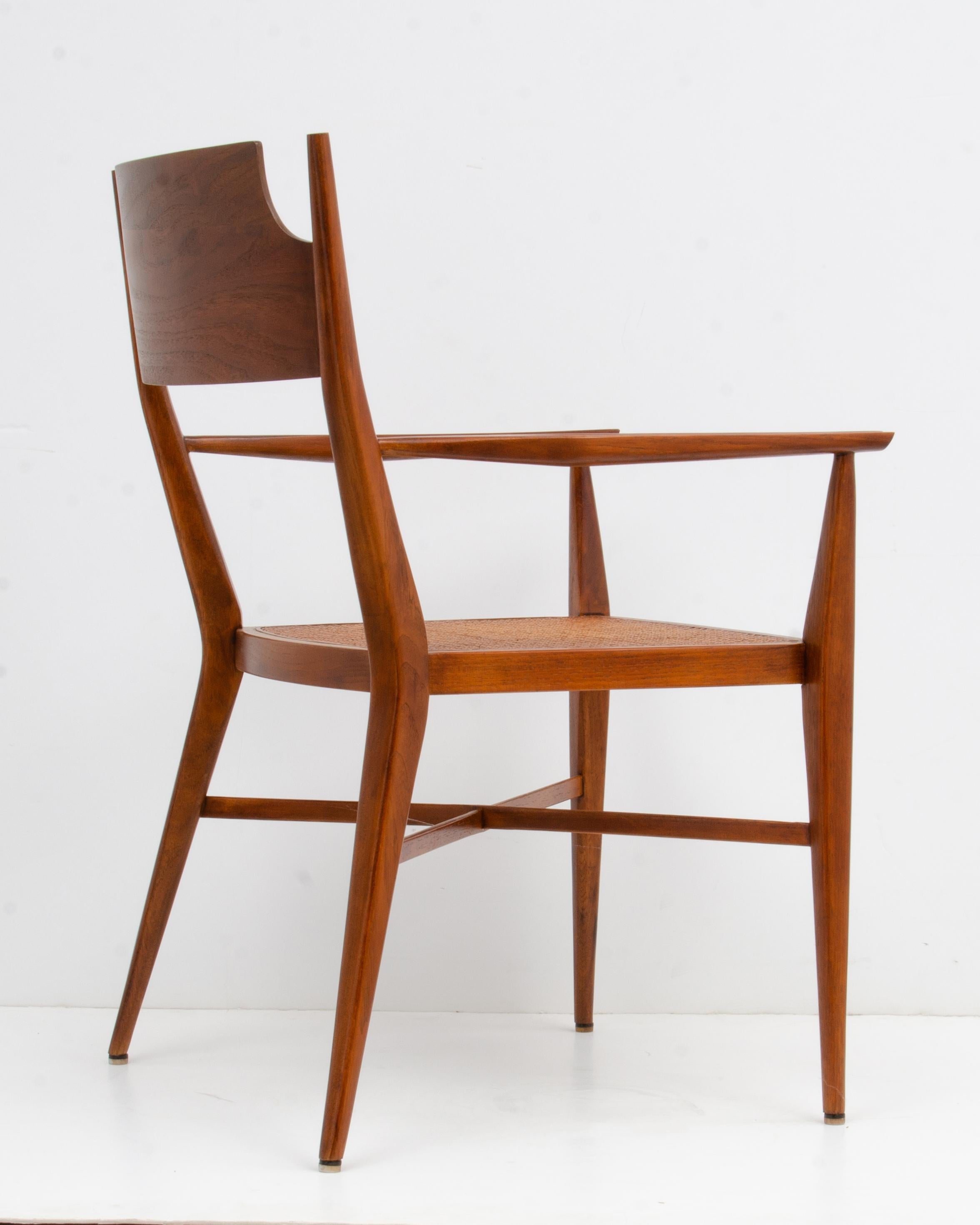American Paul McCobb Calvin Mid-Century Modern Sculpted Walnut Armchair Cane Seat For Sale
