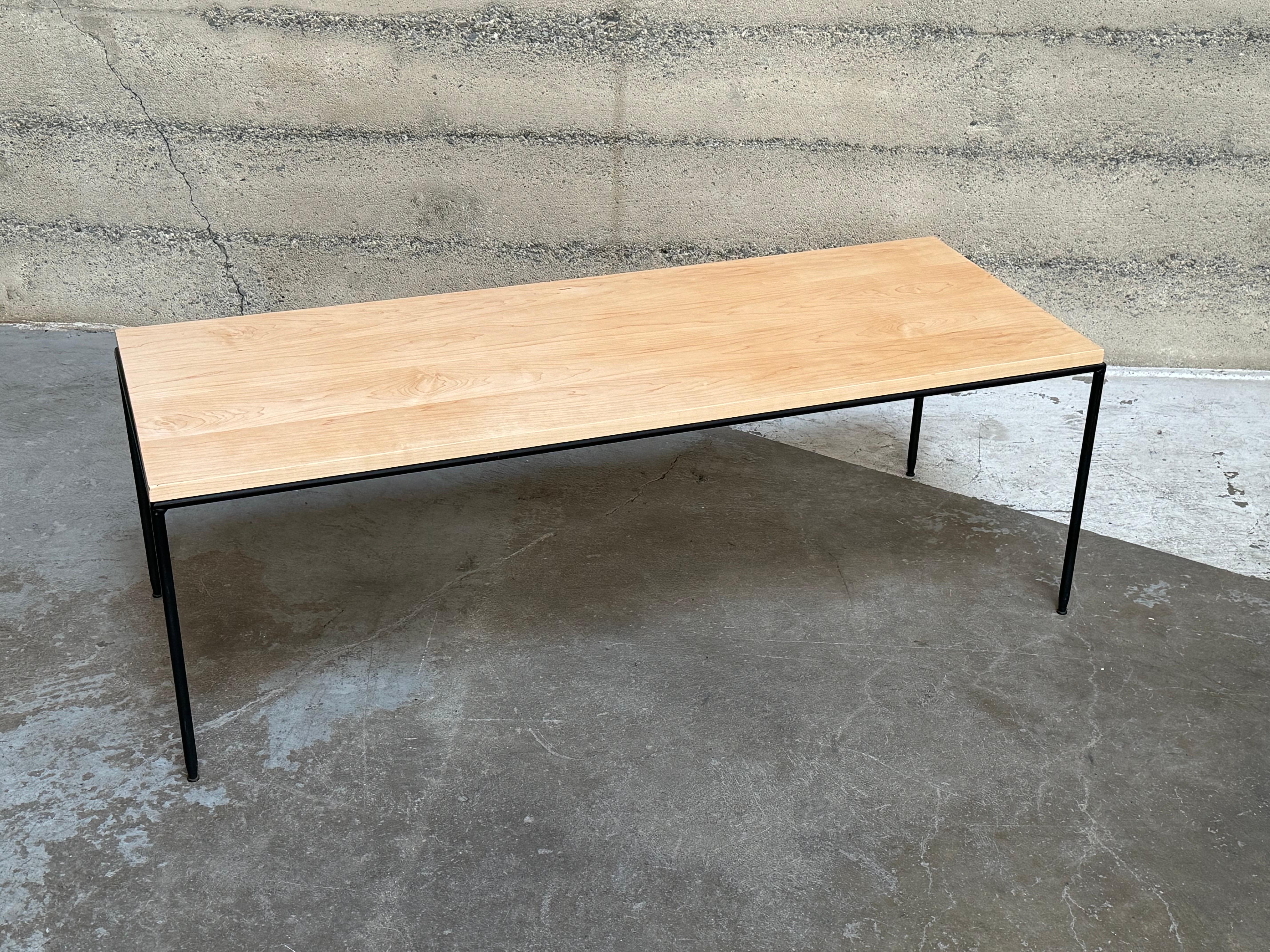 Planner Group coffee table in maple and welded iron with adjustable glides on the bottom of the legs. Designed by Paul McCobb who over the course of his career was bestowed the Good Design Award by the MoMA NY for his creations.
