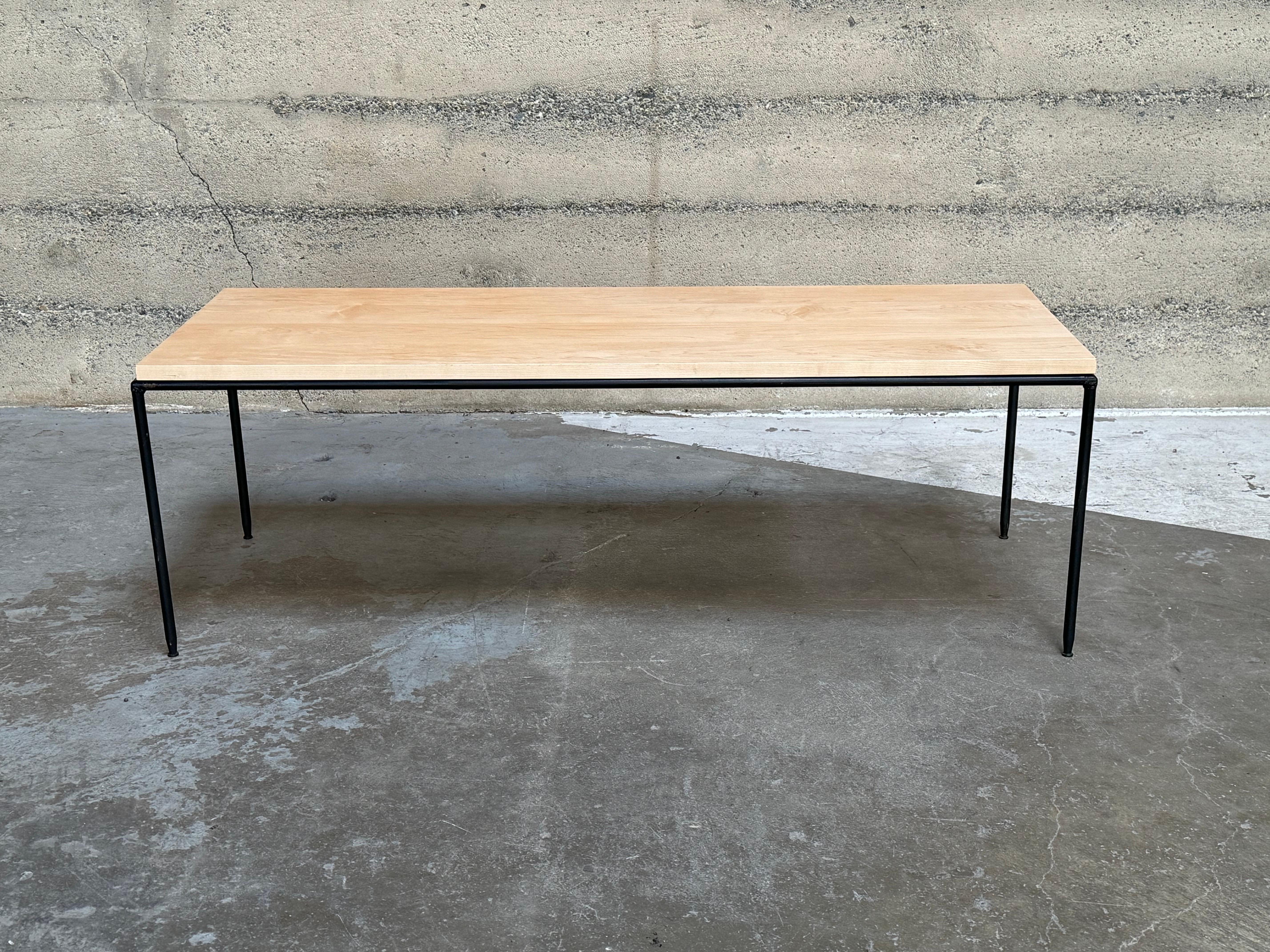 Planner Group coffee table in maple and welded iron with adjustable glides on the bottom of the legs. Designed by Paul McCobb who over the course of his career was bestowed the Good Design Award by the MoMA NY for his creations.