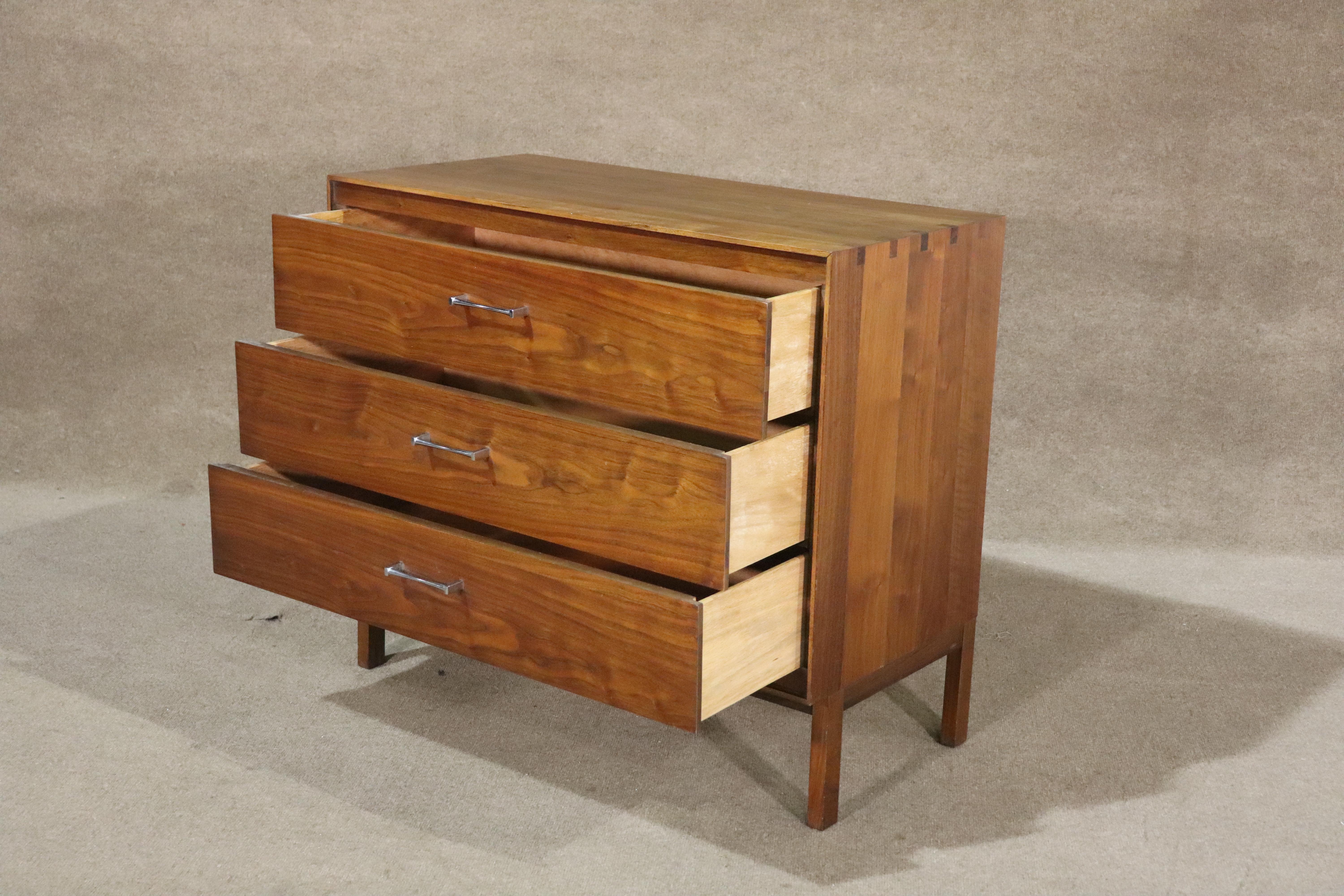 Mid-century modern dresser designed by Paul McCobb for his 'Components' line in conjunction with Lane Furniture. Warm walnut grain with rosewood inlay and polished chrome hardware.
Please confirm location NY or NJ