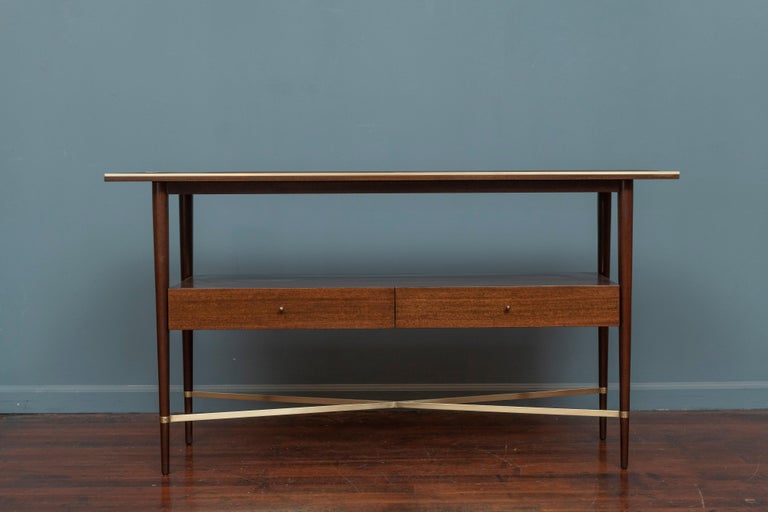Paul McCobb console table designed for his Connoisseur collection for H.Sack & Son Brookline, MA. Completely restored and ready to to install, newly refinished mahogany and polished brass frame and trim. Rare form perfect for an entry way or behind