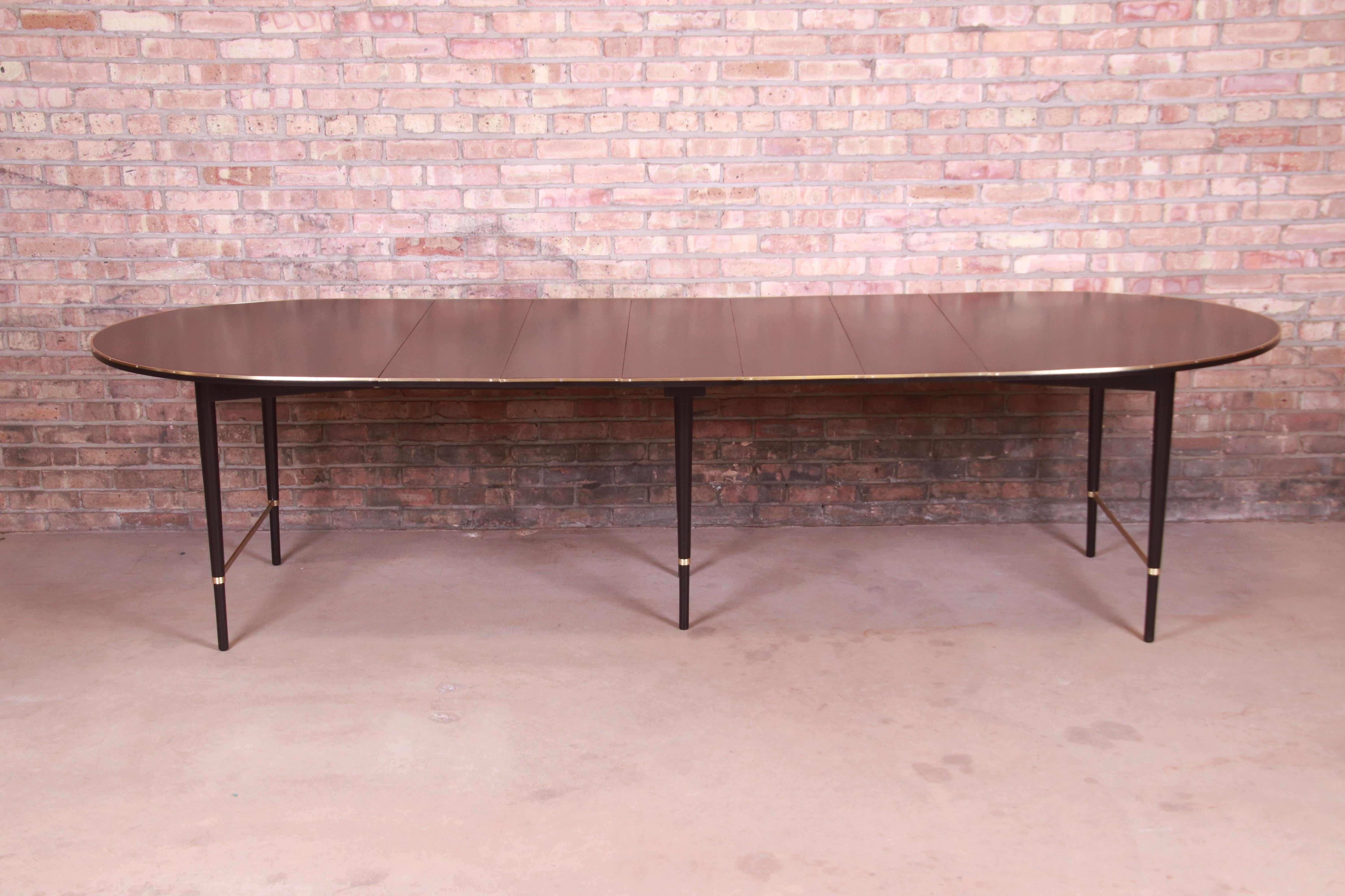 A rare and exceptional Mid-Century Modern extension dining table

By Paul McCobb for H. Sacks & Sons 