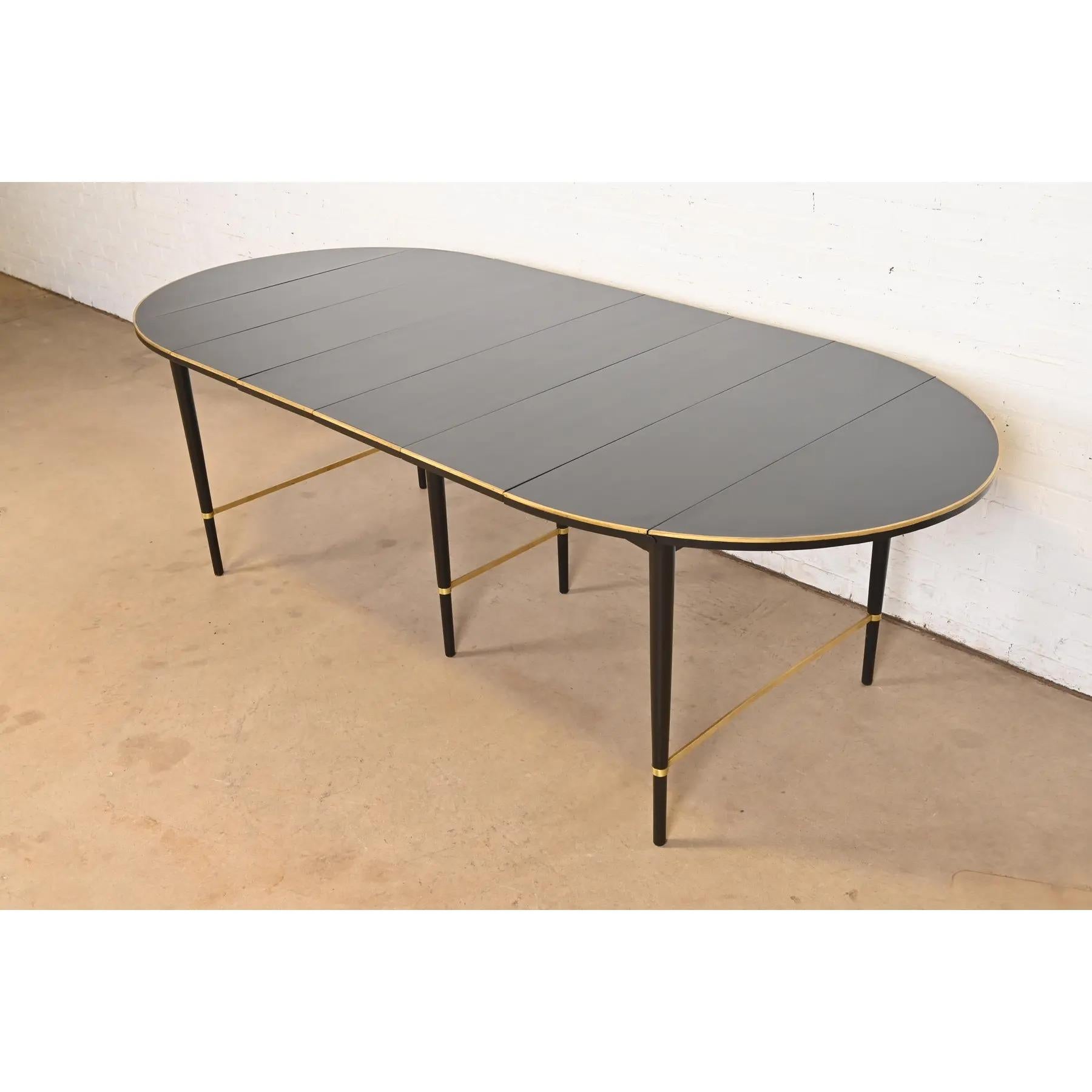 A rare and exceptional Mid-Century Modern extension drop leaf dining table

By Paul McCobb for H. Sacks & Sons, 