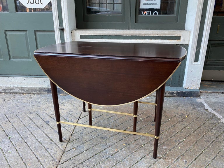 Paul McCobb Connoisseur collection dining table for H. Sacks & Sons. Beautiful Table with Brass stretchers and brass trim around Table Top. Amazing newly refinished Condition! Table can be set up in multiple configurations to use easily in many