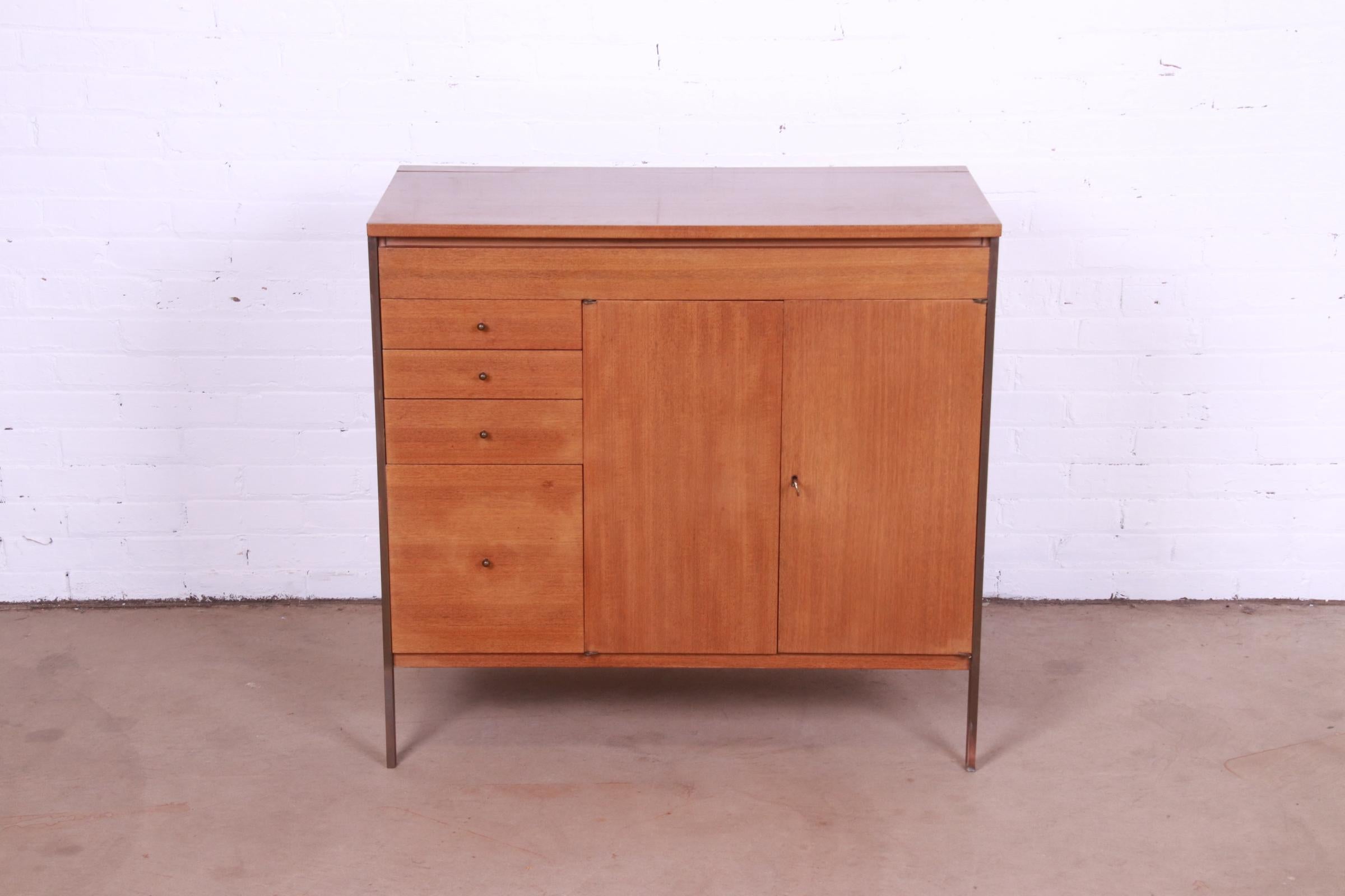 A rare and exceptional Mid-Century Modern lift top bar cabinet

By Paul McCobb for H. Sacks & Sons, 