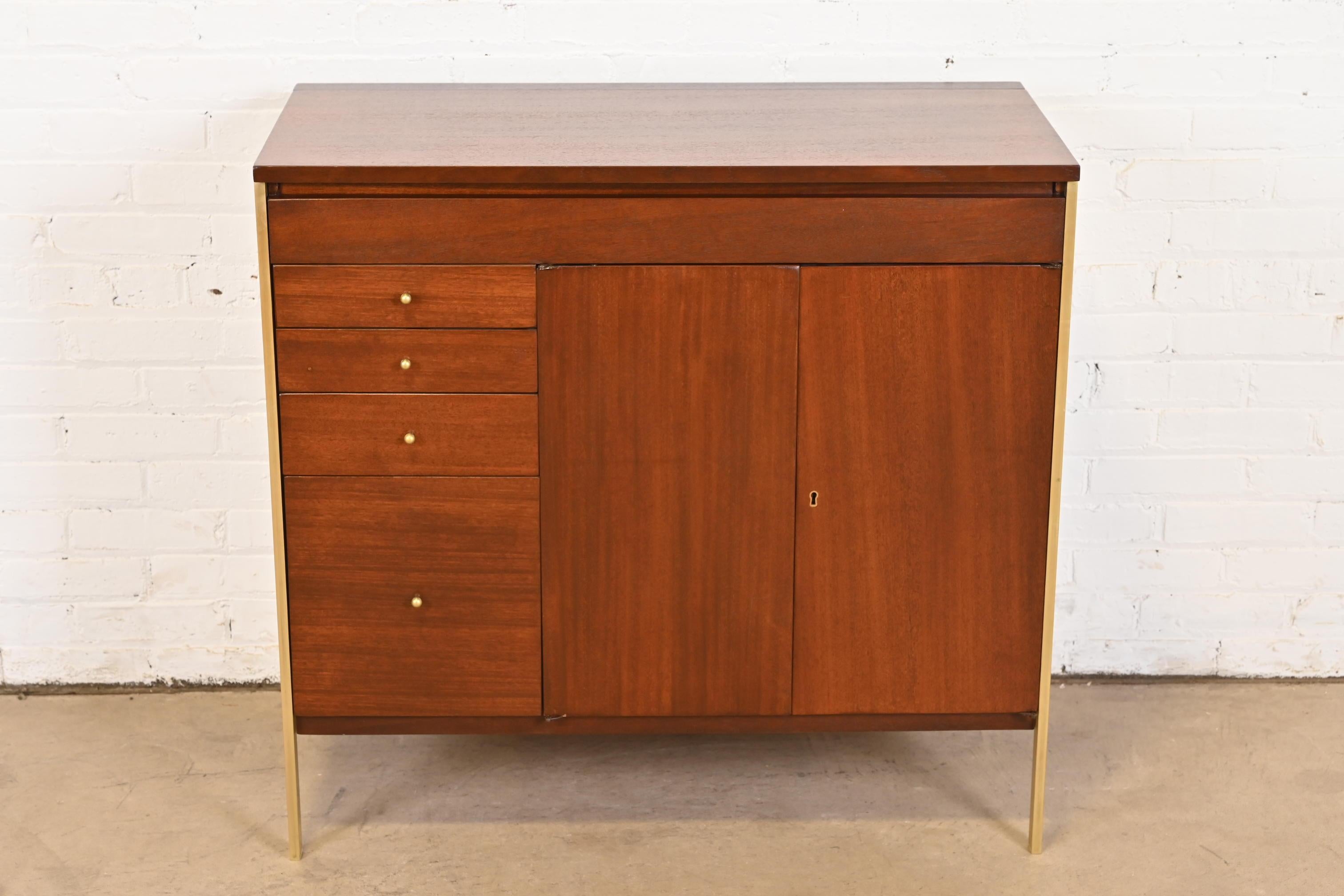 A rare and exceptional Mid-Century Modern lift top bar cabinet

By Paul McCobb for H. Sacks & Sons, 