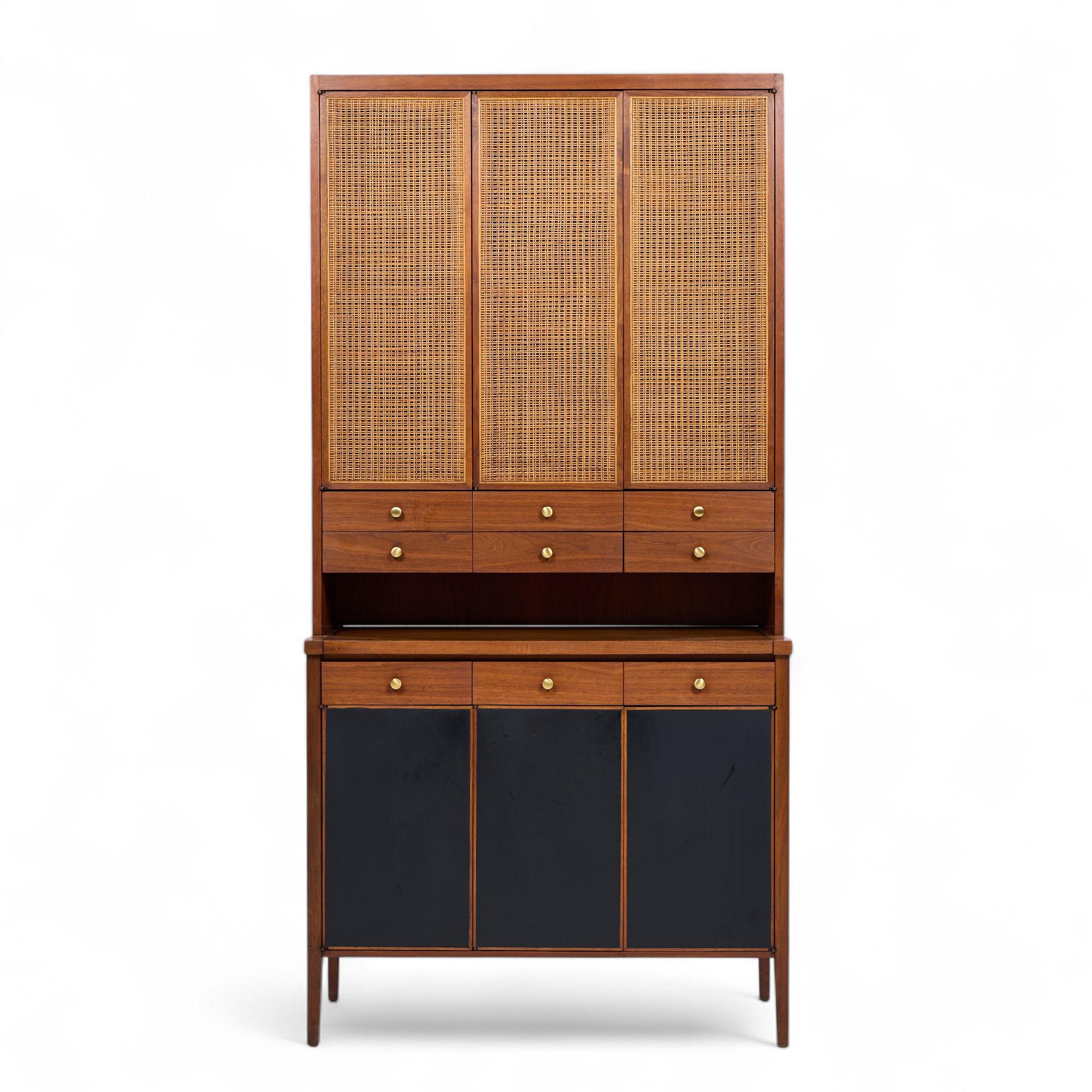 Paul McCobb Connoisseur Collection Mid Century Mahogany and Cane Secretary Bar Cabinet

This secretary measures: 38.25 wide x 18 deep x 77.5 inches high

All pieces of furniture can be had in what we call restored vintage condition. That means the