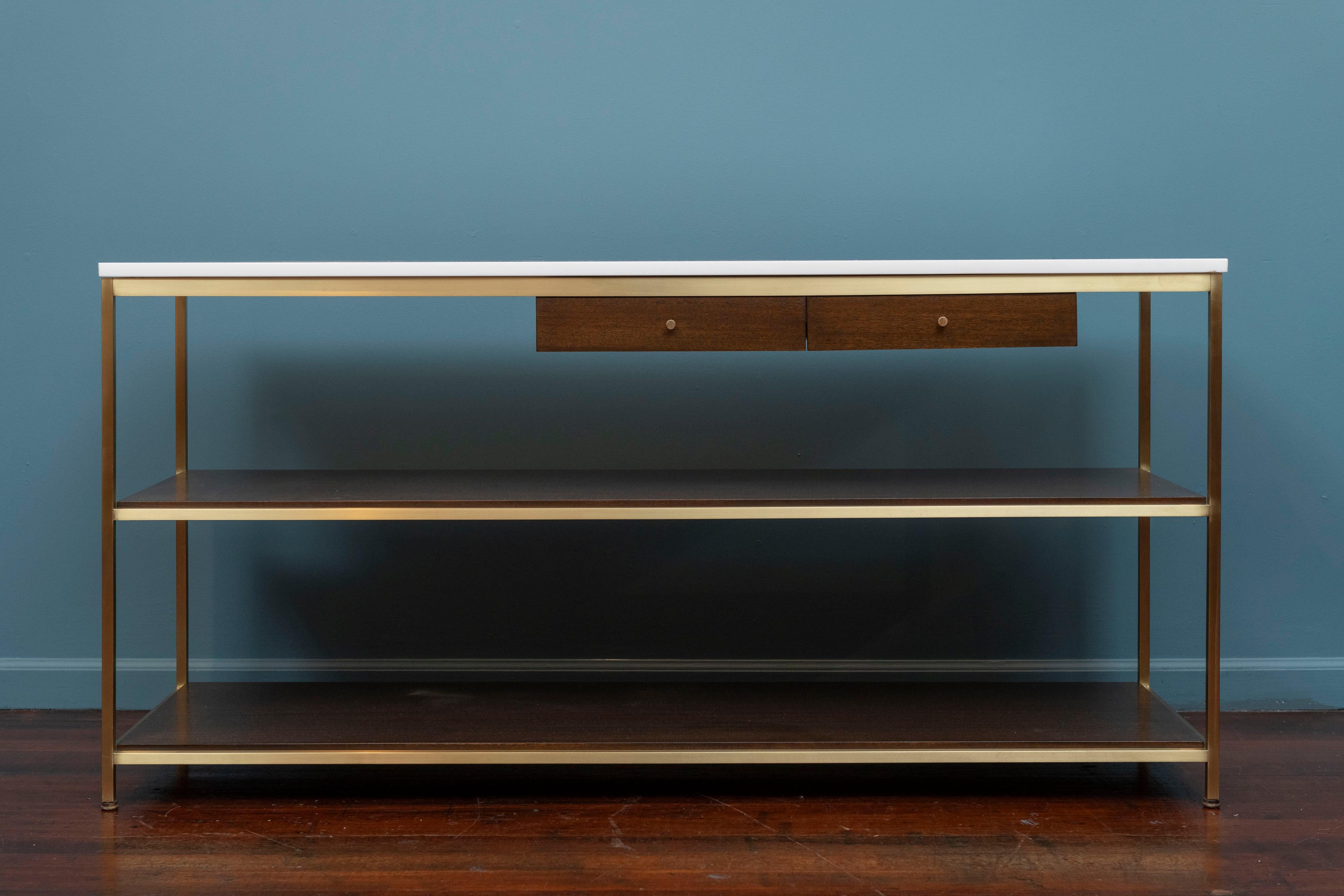 Paul McCobb design console table for Calvin Furniture, Model 9315. Sophisticated and sleek design that epitomizes Mid-Century Modern design from one of the master's Paul McCobb. High quality construction and materials, including a brass square