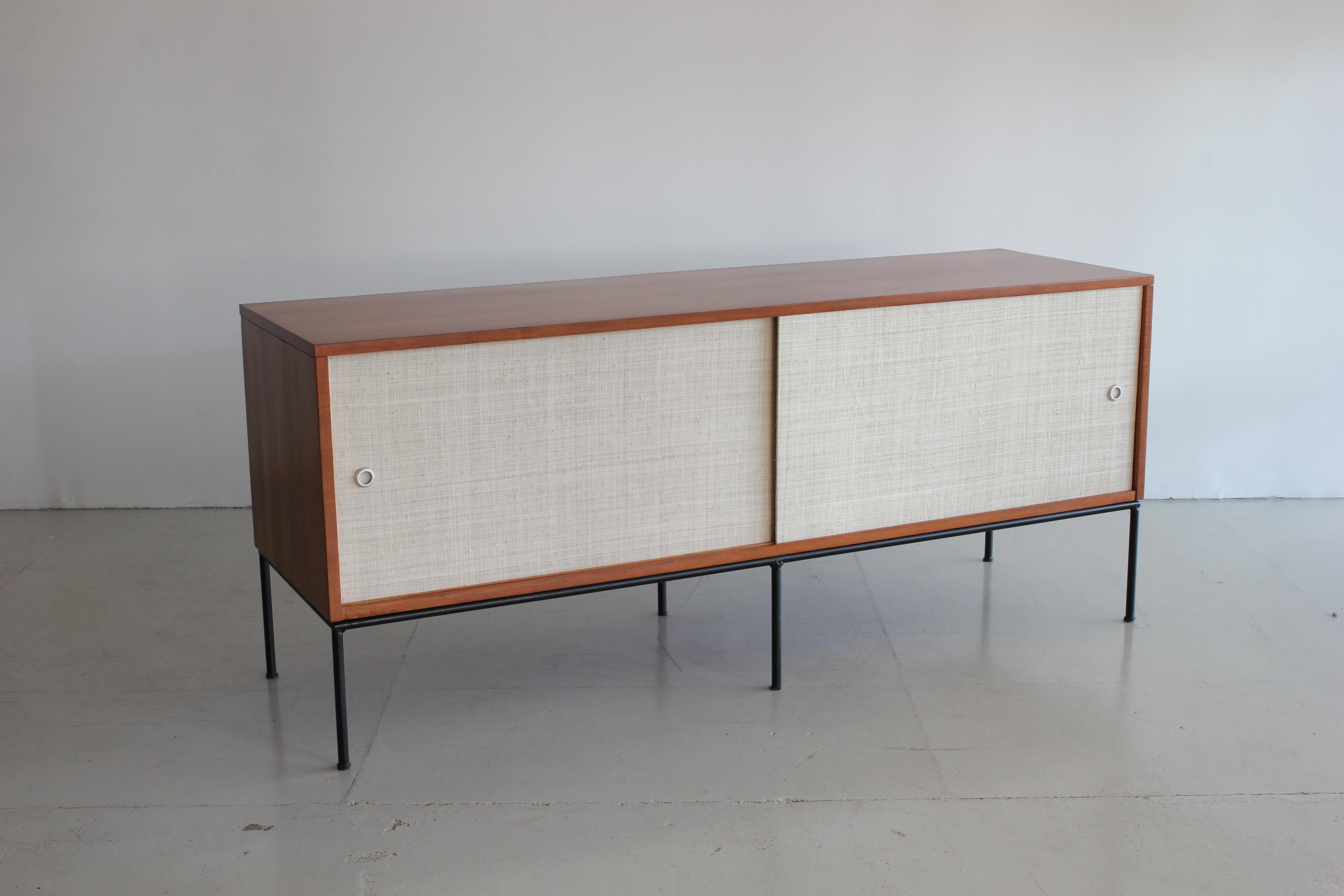 Paul McCobb credenza with sliding newly caned doors and open shelving on Classic black iron base. 

 