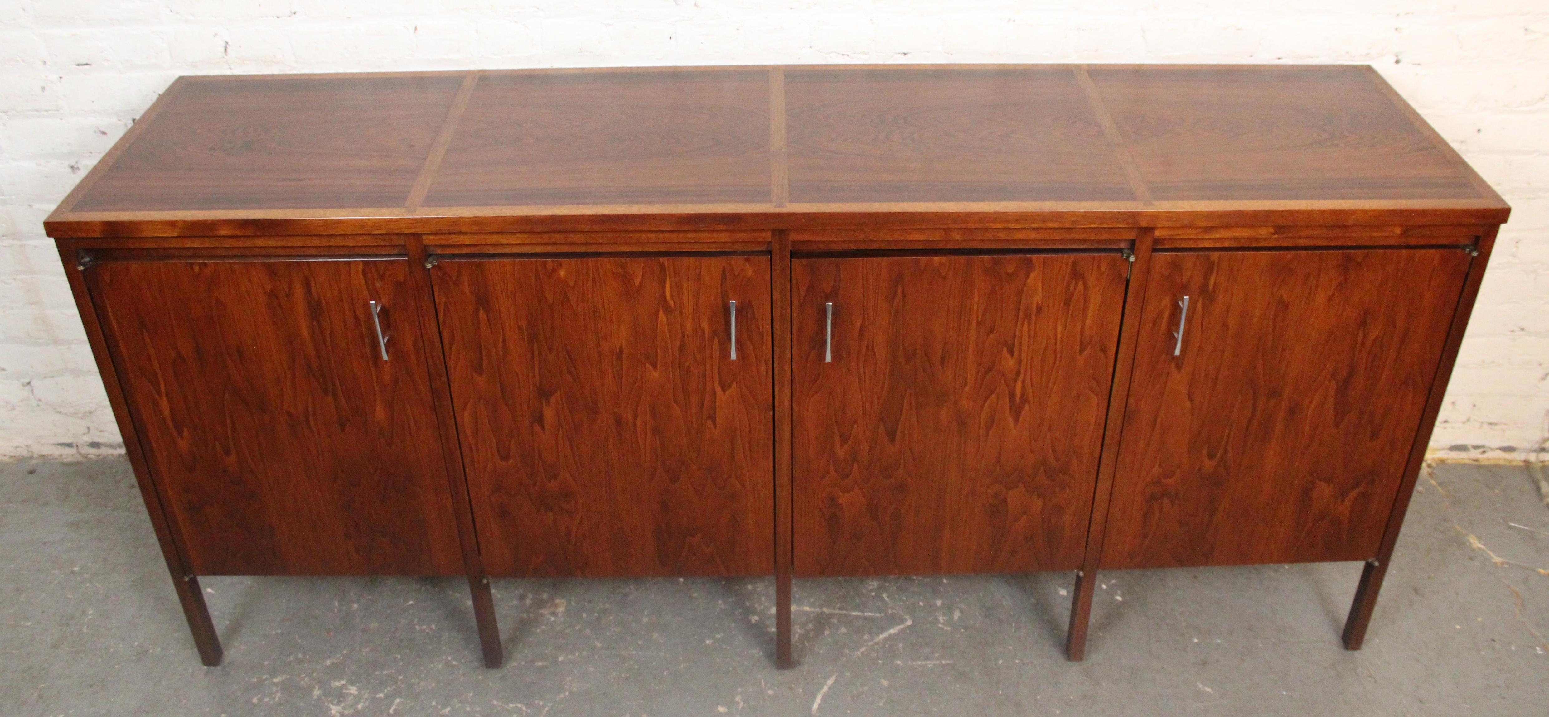Two of the mid-century's most accomplished furniture makers came together for the Delineator line. Paul McCobb designed this for Lane Furniture in rich walnut with rosewood top, dovetailed edges and chrome pulls.
Please confirm location NY or NJ