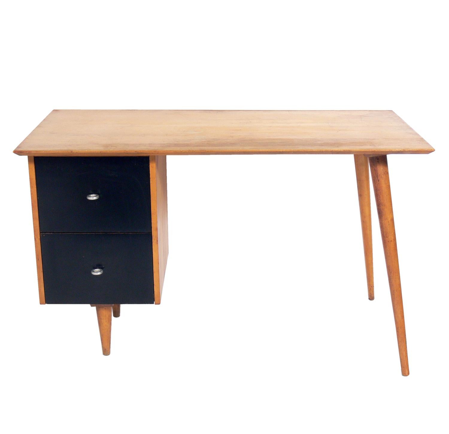 Mid-Century Modern desk and chair, designed by Paul McCobb for Planner Group, American, circa 1950s. This desk and chair are currently being refinished and can be completed in your choice of color. They can be refinished in a solid color, such as