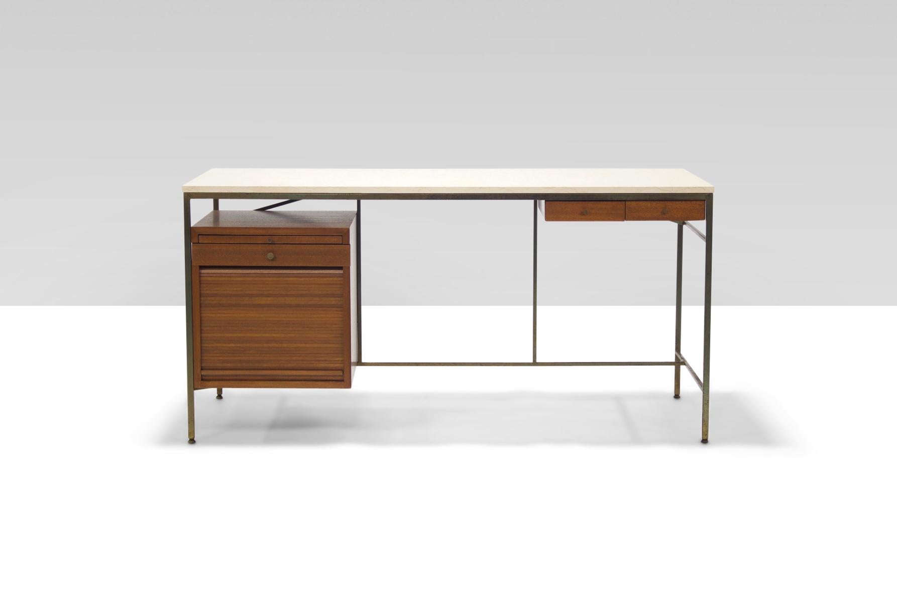 Rare architectural walnut and stone desk designed by Paul Mccobb for Calvin Furniture in the early 1950's.

The left hand pedestal features a slide out work surface, a small drawer, and a tambour front door that reveals a larger storage