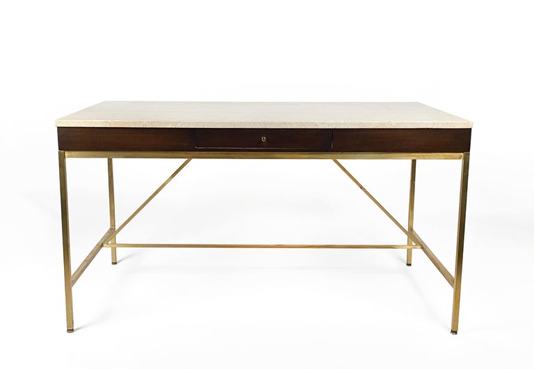 Extraordinary McCobb desk with two writing surfaces that slide out on the left & right side, pencil drawer from the Irwin Collection by Calvin. Desk is in exceptional restored condition with the original travertine top. 
  