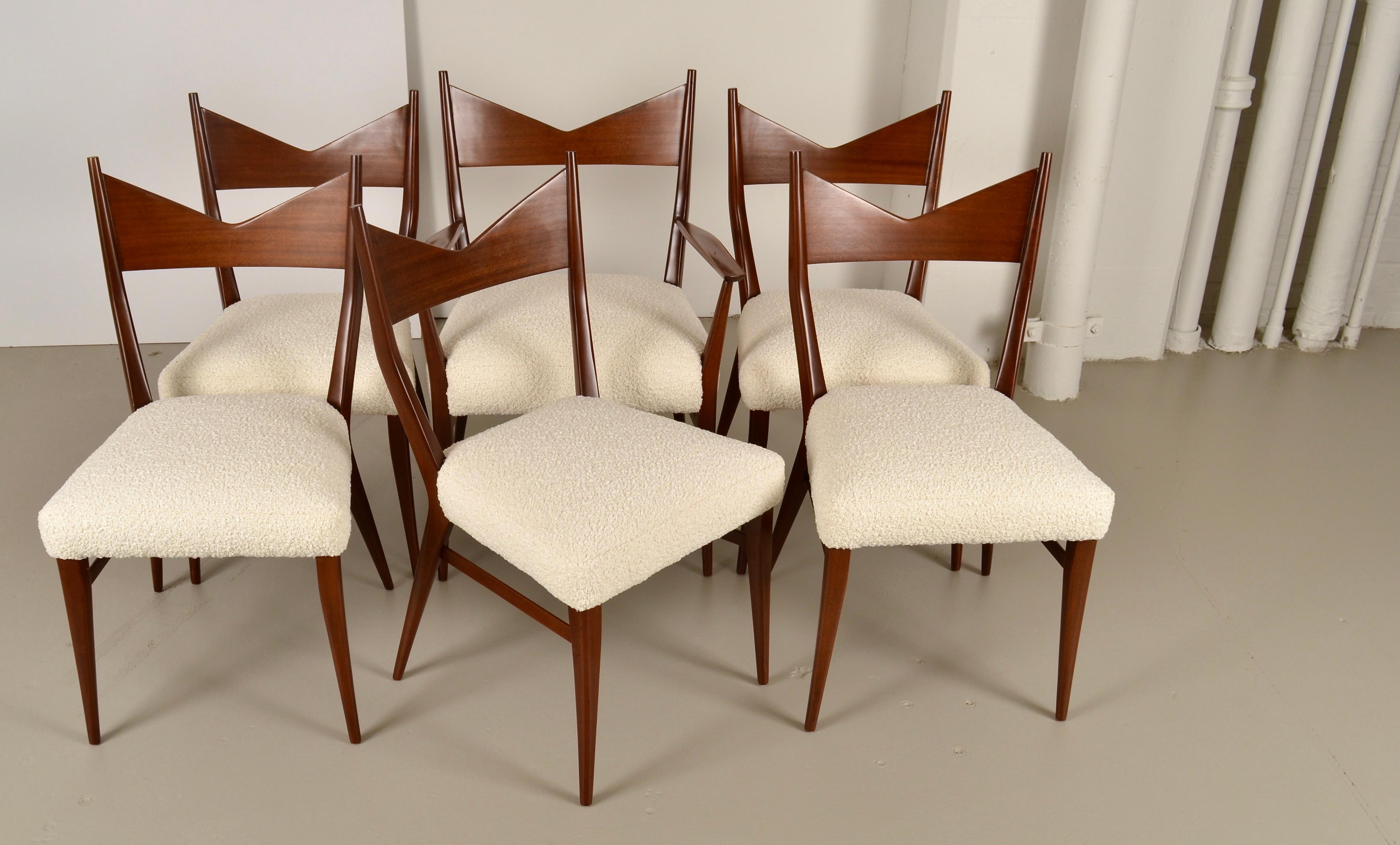 Classic dining chairs designed by Paul McCobb for Calvin Furniture, in the 1950s. This set has been comprehensively restored. The walnut frames have been refinished in a warm brown stain, satin lacquer finish. All new upholstery in luxurious wool