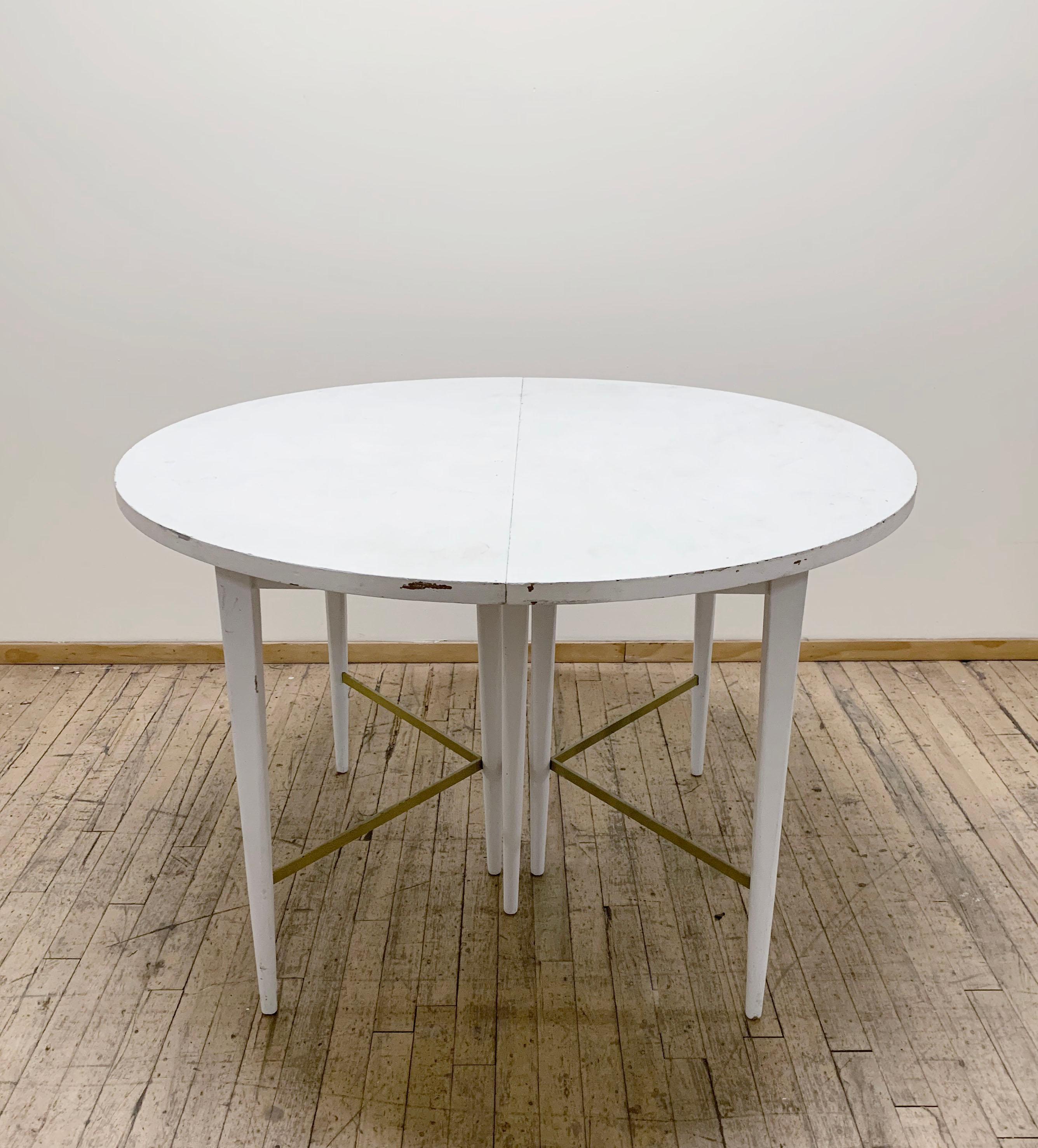 Paul McCobb Directional Dining Table with Brass Stretchers

One of the more desirable dining table forms with brass stretchers  by Paul Mccobb. Produced by Calvin as part of the 