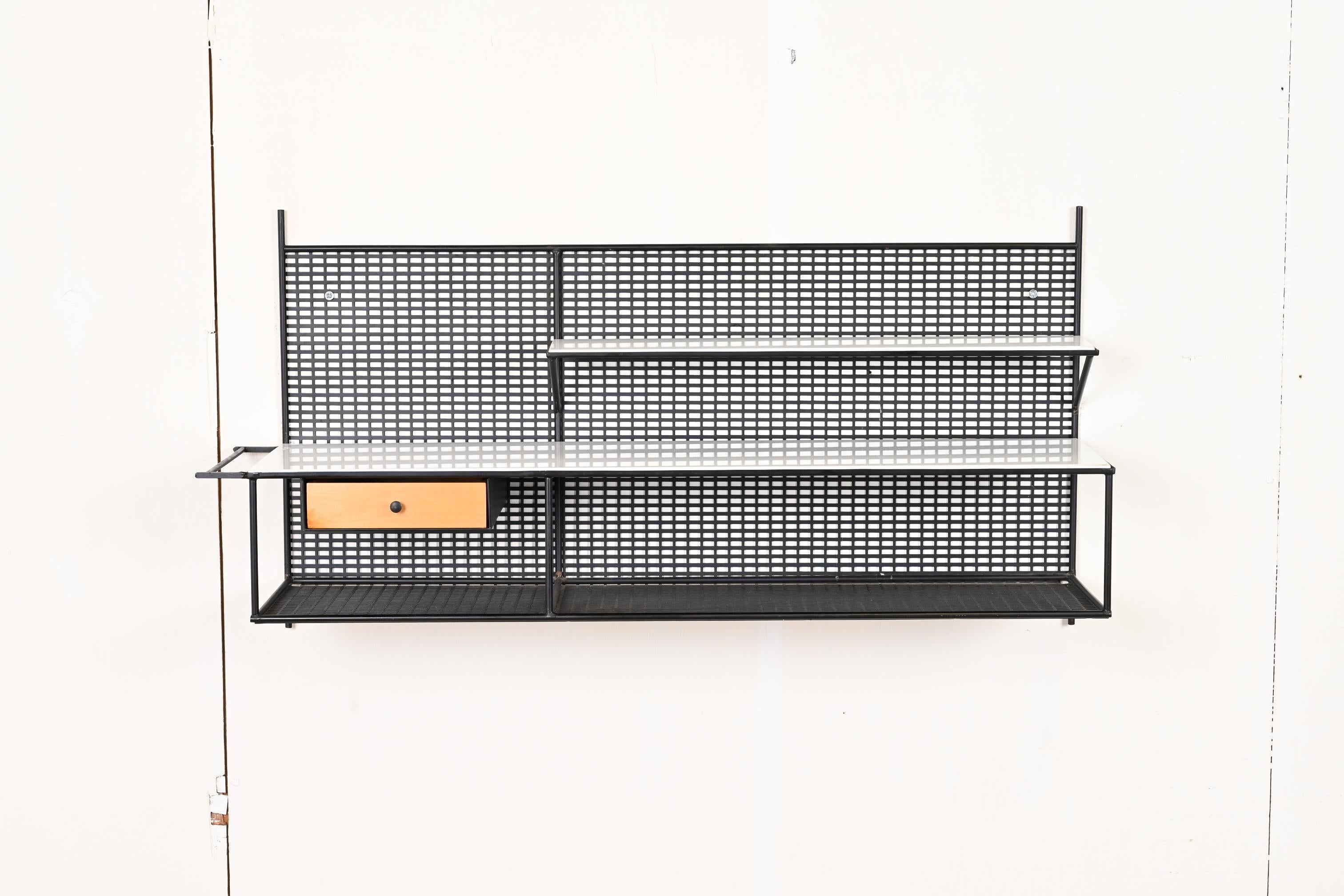 A rare and exceptional Mid-Century Modern wall-mounted floating three-tier console or shelf

By Paul McCobb for Bryce Originals

USA, 1950s

Black enameled steel, with original white Vitrolite glass shelves and birch drawer.

Measures: