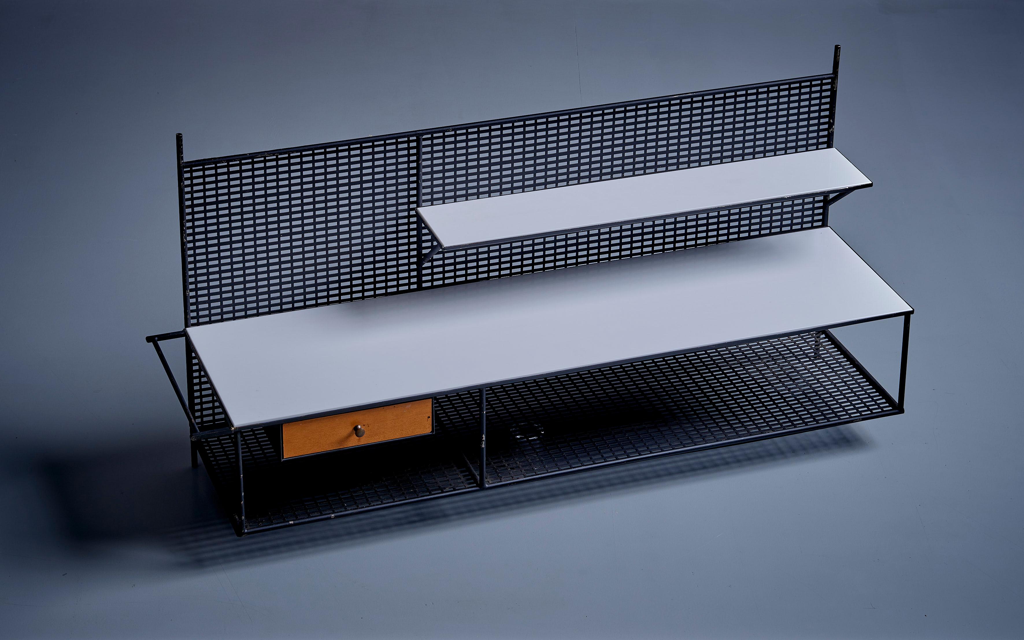 Paul McCobb for Bryce Wall Shelf in Wood and Metal, USA - 1950s. Wall-mounted floating console with wooden drawer and black metal frame. Shelves are covered with white Vitrolite glass panels. Fair original condition. 

Paul McCobb (1917-1969) was an