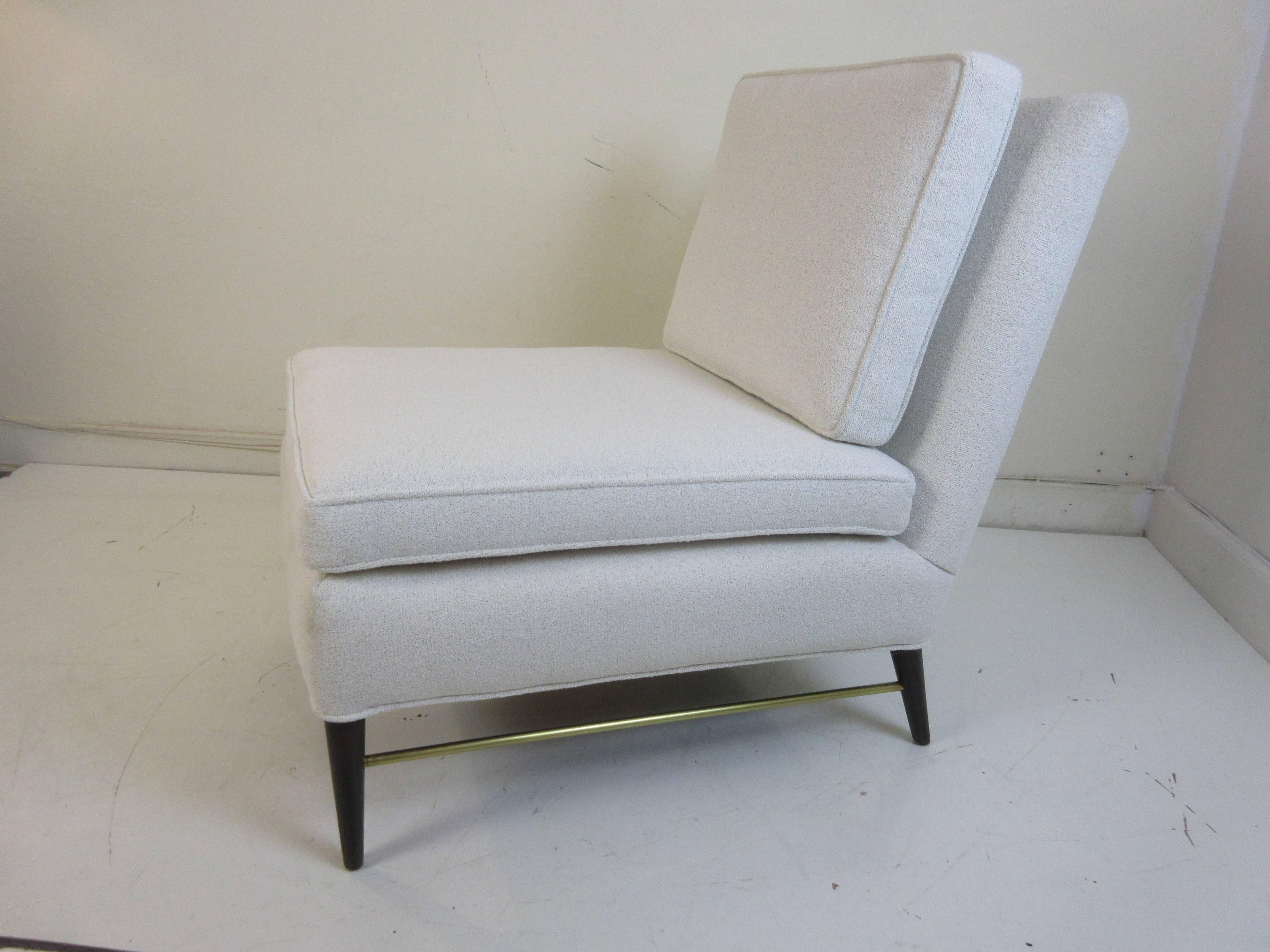 Paul McCobb for Calvin chair in new white fabric with brass stretchers.