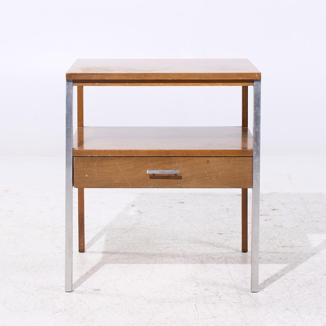 Paul McCobb for Calvin Linear Mid Century Walnut and Aluminum Nightstand

This nightstand measures: 21 wide x 21 deep x 24 inches high

We take our photos in a controlled lighting studio to show as much detail as possible. We do not Photoshop out