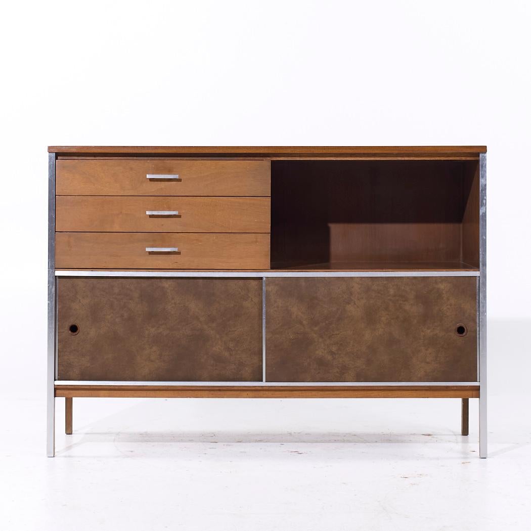 Paul McCobb for Calvin Linear Mid Century Walnut Credenza

This credenza measures: 48 wide x 18 deep x 34.25 inches high

We take our photos in a controlled lighting studio to show as much detail as possible. We do not Photoshop out