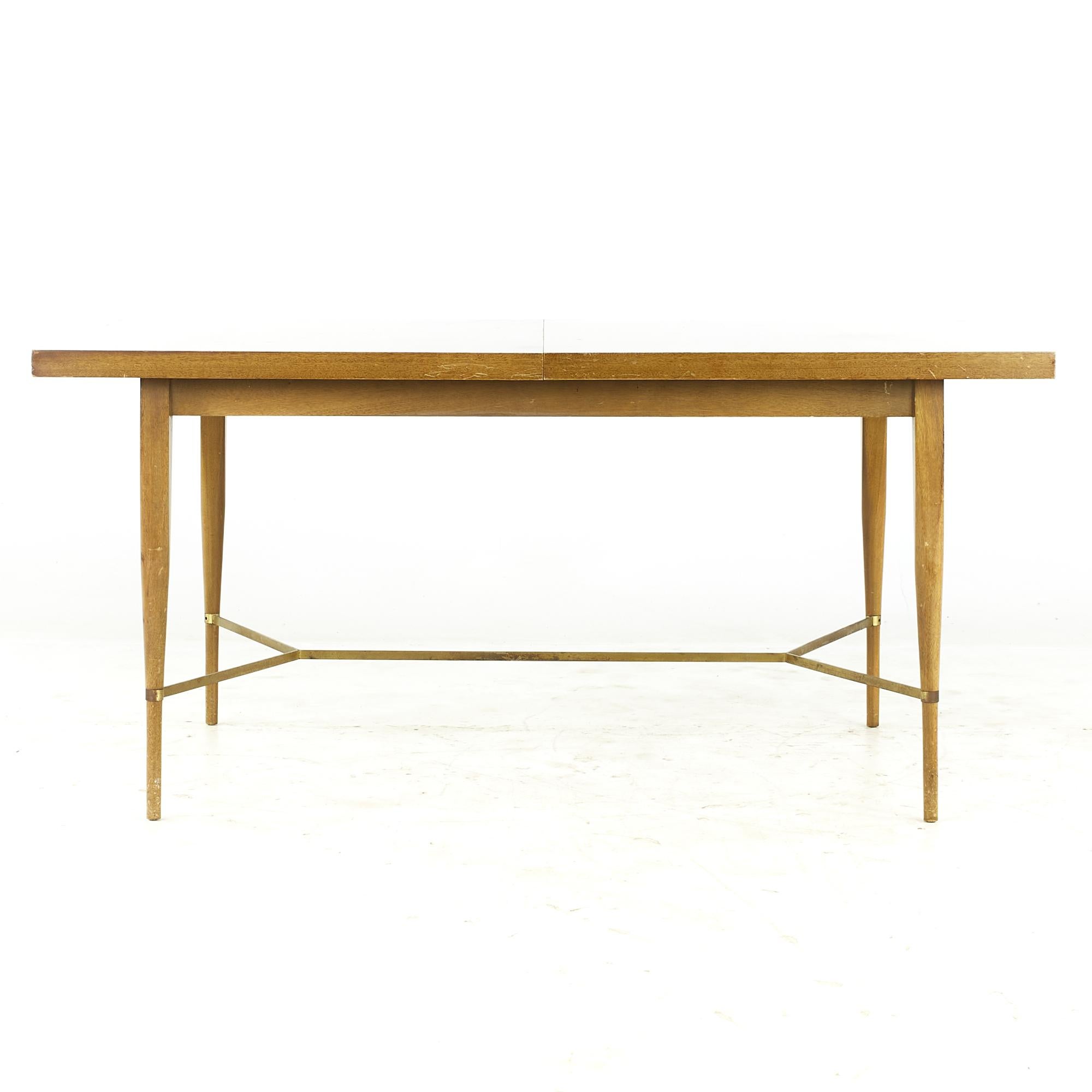 Paul McCobb for Calvin midcentury Brass and Mahogany Dining Table with Leaves

This table measures: 60 wide x 38 deep x 28.75 high, with a chair clearance of 24.5 inches, each leaf measures 12 inches wide, making a maximum table width of 84 inches