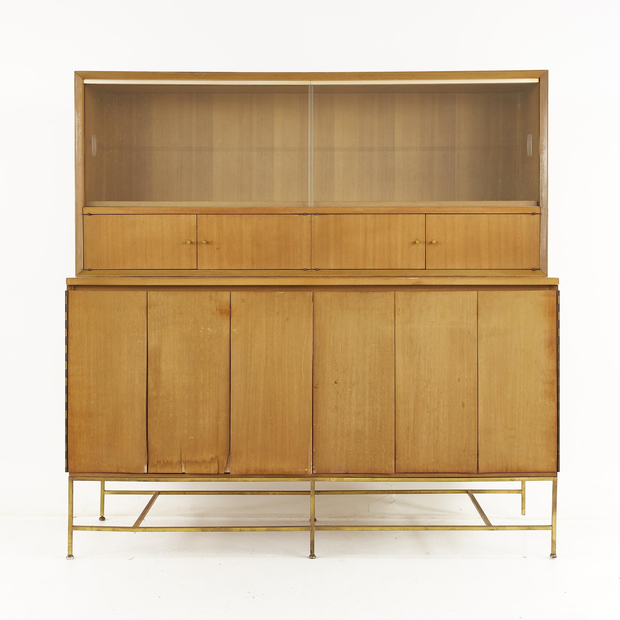 Paul McCobb for Calvin mid century brass base credenza with hutch

The credenza measures: 60 wide x 19 deep x 60.75 inches 

All pieces of furniture can be had in what we call restored vintage condition. That means the piece is restored upon