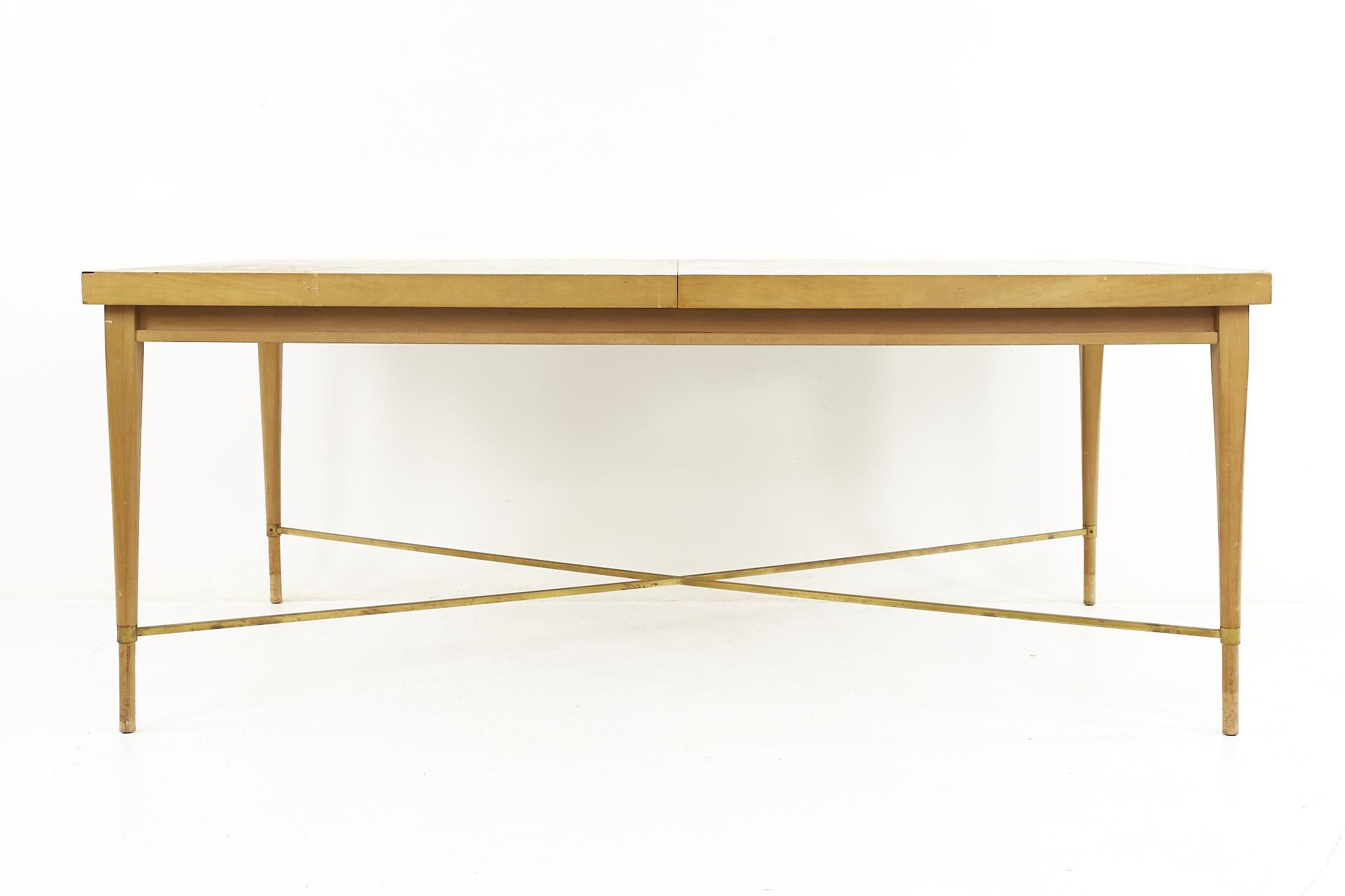 Paul McCobb for Calvin mid century brass X base dining table

The table measures: 71.75 wide x 40 deep x 29 high, with a chair clearance of 24.5 inches; each leaf is 15 inches wide, making a maximum table width of 101.75 inches when both leaves