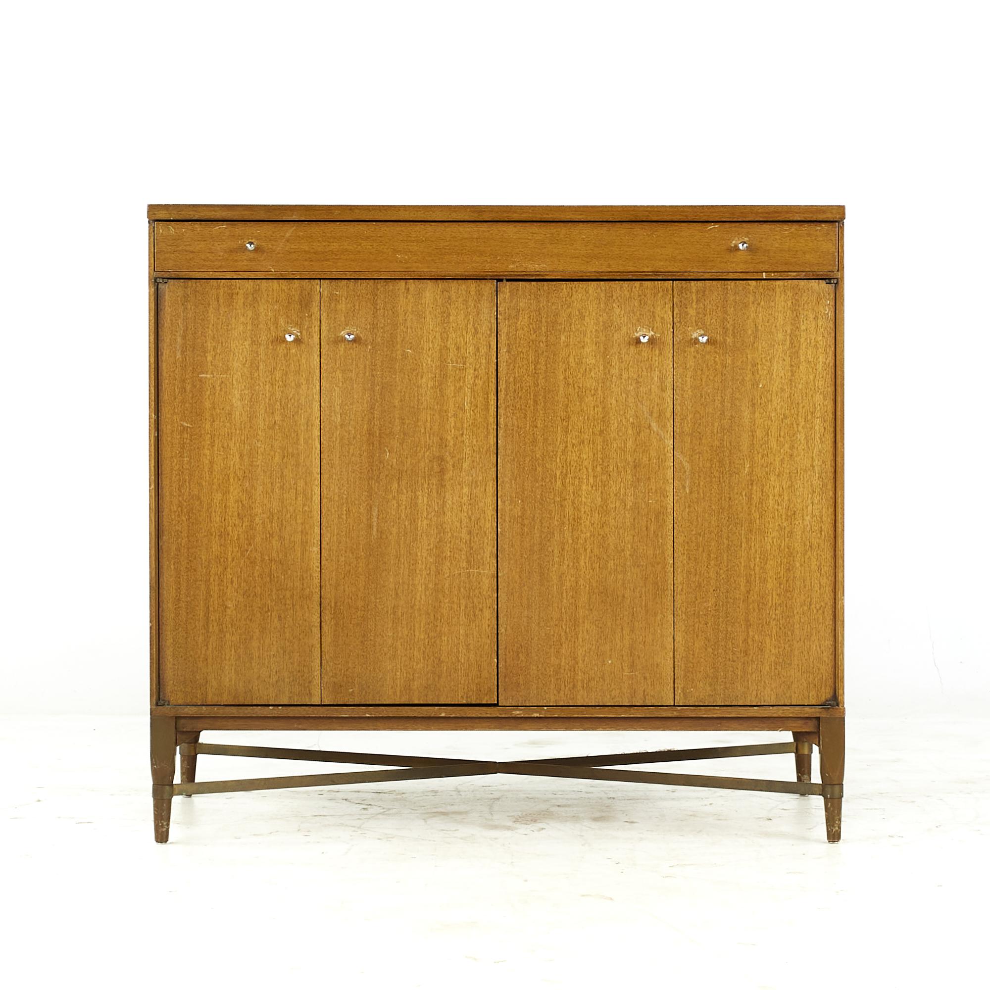 Paul McCobb for Calvin midcentury Mahogany and Brass Bar Credenza Cabinet

This credenza measures: 36 wide x 19.25 deep x 33.25 inches high

All pieces of furniture can be had in what we call restored vintage condition. That means the piece is