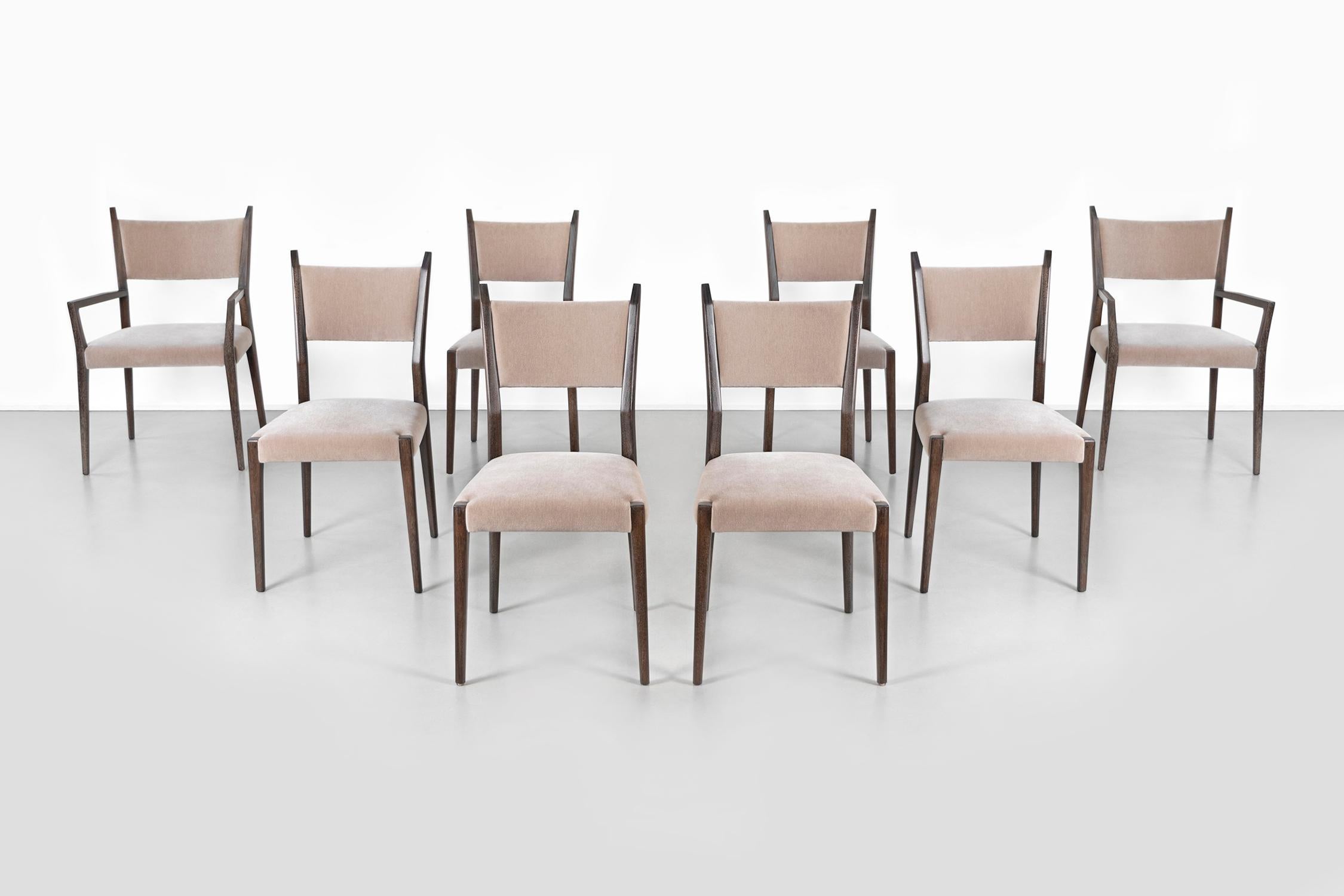 set of eight Irwin Collection model C9002 dining chairs 

designed by Paul McCobb for Calvin 

USA, circa 1950s

mahogany and mohair

chairs with arms: 35 ¼” h x 22 ½” W x 21” D x seat 18 ¼” H x arm 24 ½” H

chairs without arms: 35 ¼” H x