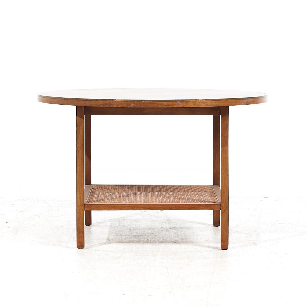 Paul McCobb for Calvin Mid Century Walnut and Cane Coffee Table

This coffee table measures: 32 wide x 32 deep x 20.25 inches high

All pieces of furniture can be had in what we call restored vintage condition. That means the piece is restored upon