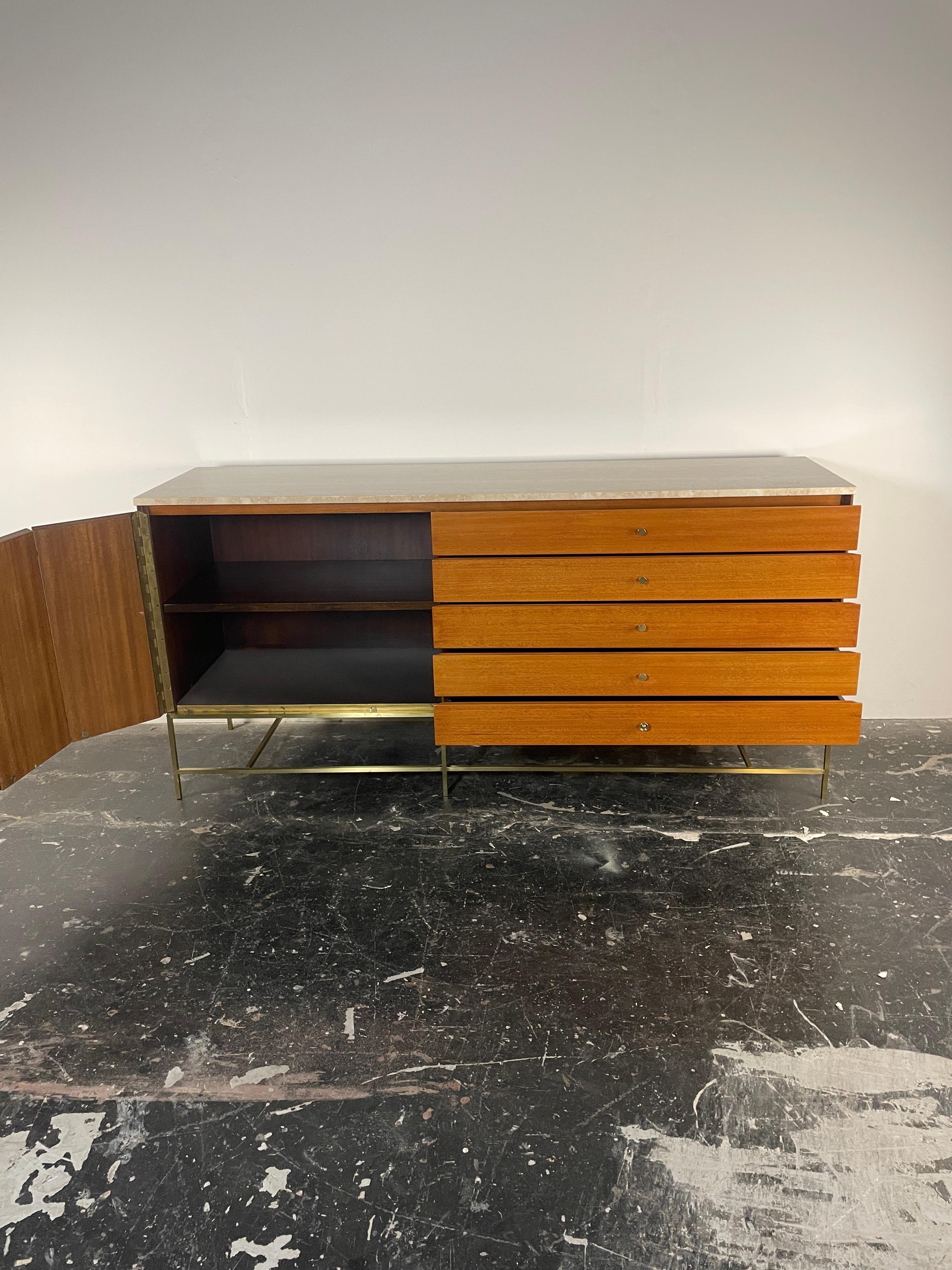 Paul McCobb for Calvin Furniture travertine top credenza or sideboard. The Irwin Collection. Brass legs with travertine top. Labeled on the inside. 
Paul McCobb for Calvin Furniture travertine top credenza or sideboard. 'The Irwin Collection'. Brass