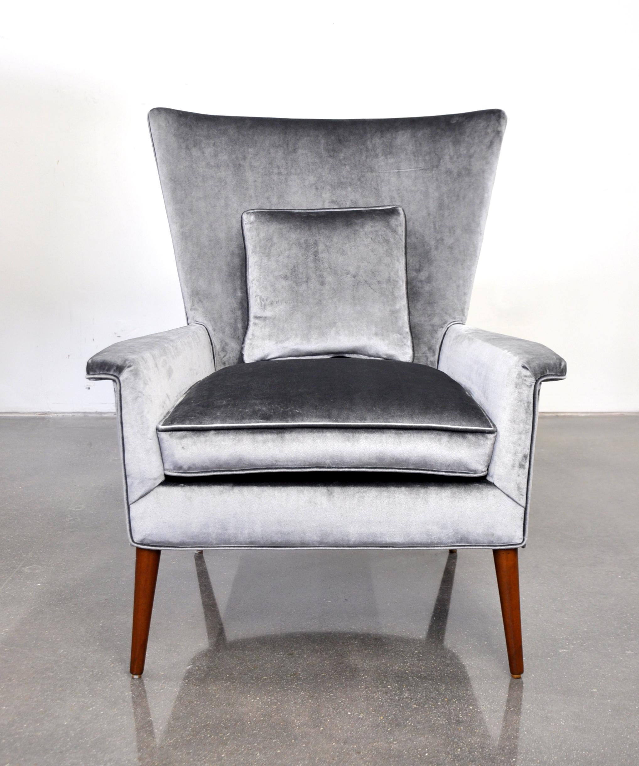 Rare Mid-Century Modern high back armchair designed by Paul McCobb for the Planner Group line and first manufactured by Custom Craft in 1950. Reupholstered in silver light gunmetal grey cotton velvet, the chair features a winged-back highback design
