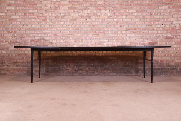 Mid-Century Modern Paul McCobb for Directional Black Lacquer and Brass Boat-Shaped Dining Table For Sale