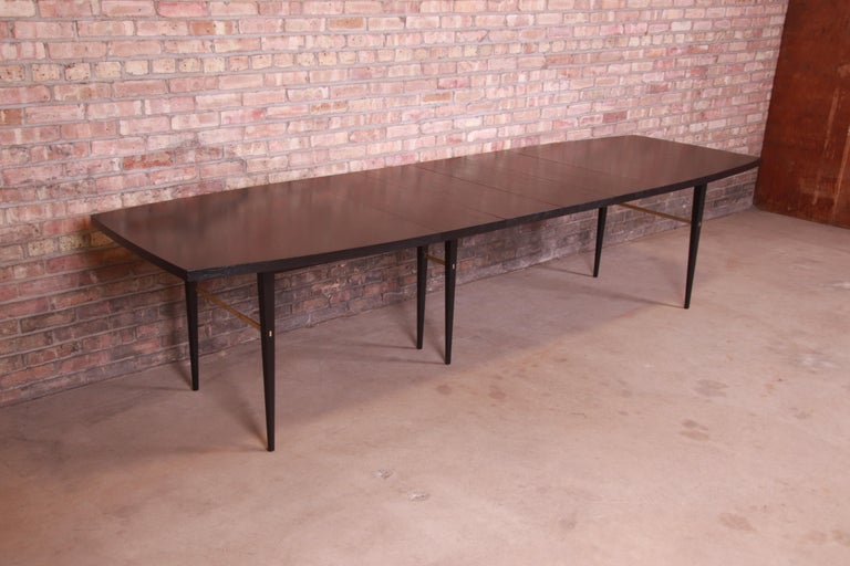 Paul McCobb for Directional Black Lacquer and Brass Boat-Shaped Dining Table In Good Condition For Sale In South Bend, IN