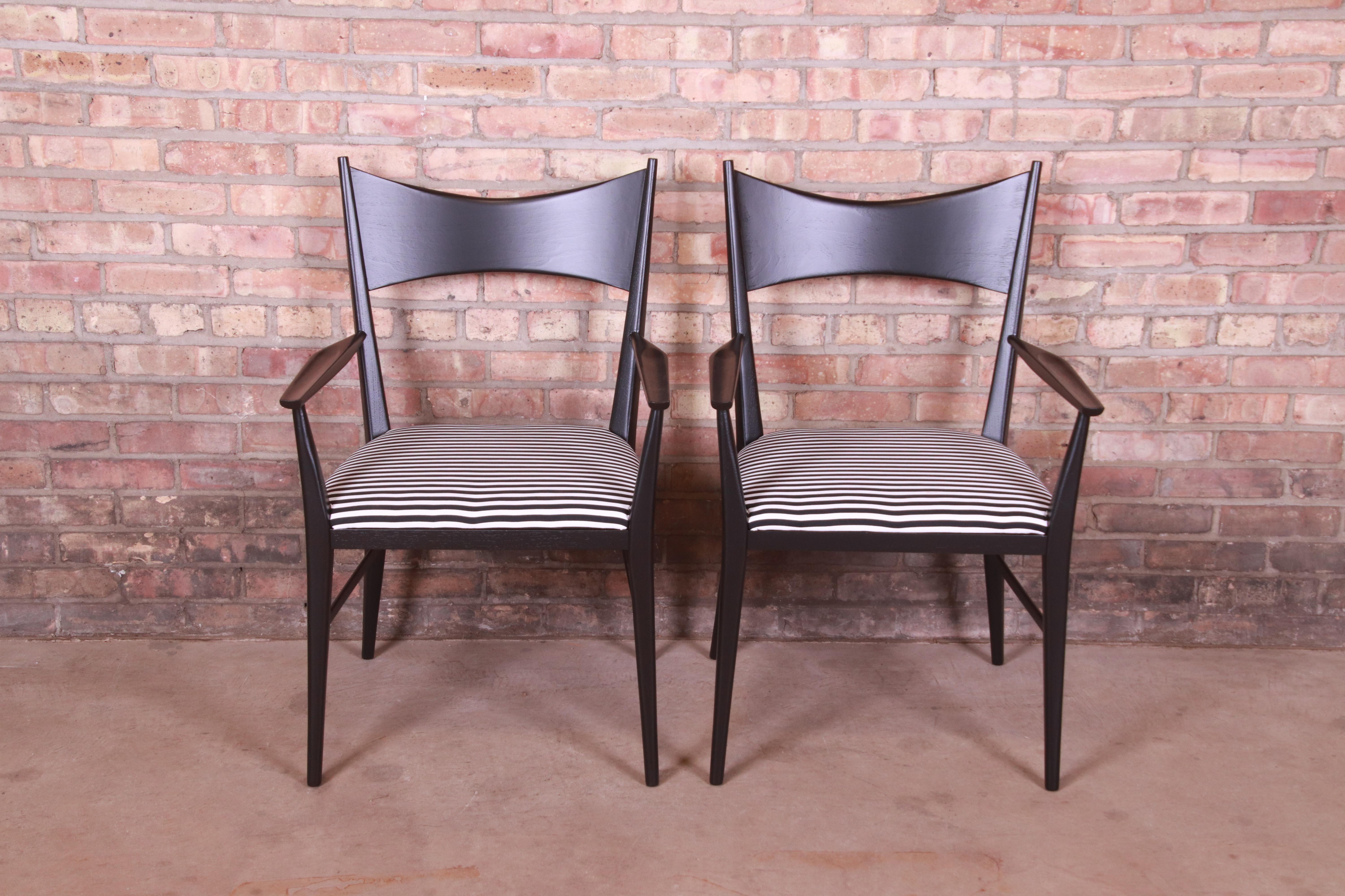 A gorgeous pair of Mid-Century Modern club chairs or dining armchairs

By Paul McCobb for Directional and produced by Calvin Furniture

USA, 1950s

Black lacquered sculpted walnut, with upholstered seats.

Measures: 22