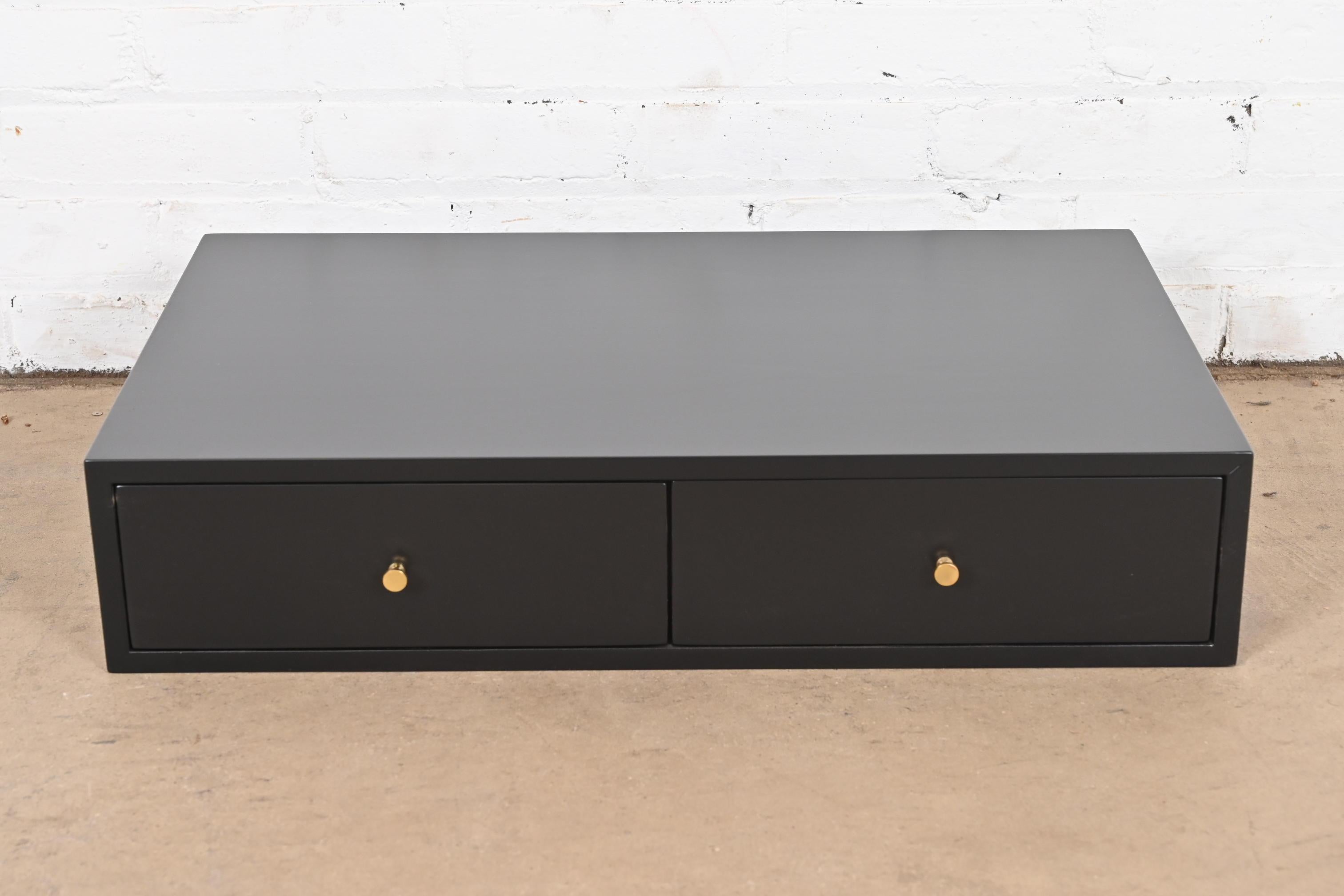 An exceptional Mid-Century Modern dresser top two-drawer jewelry chest

By Paul McCobb for Directional Furniture

USA, 1950s

Black lacquered mahogany, with original brass drawer pulls and felt-lined interior.

Measures: 24