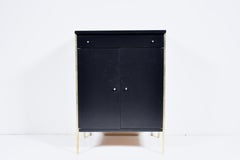 Paul McCobb for Directional Black Two Door Cabinet with Brass Leg Posts