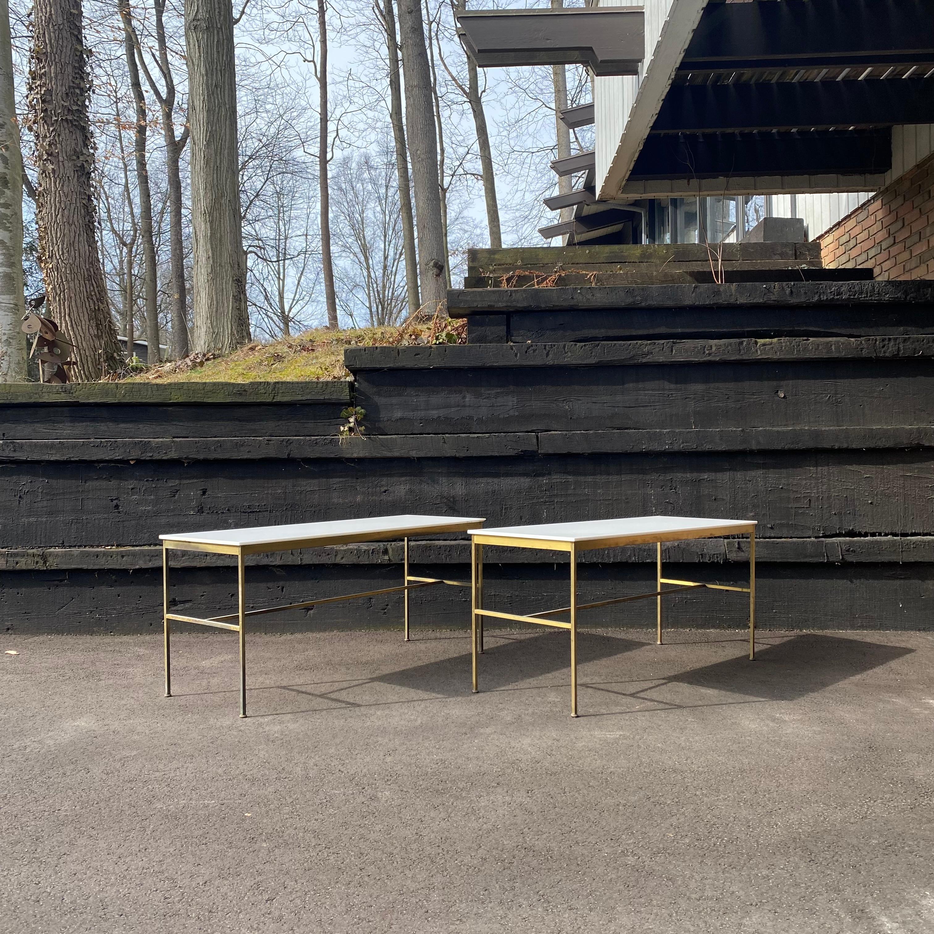 This is an absolutely gorgeous pair of all-original brass and white Carrara glass console table designed by Paul McCobb for Directional Furniture, ca. 1950's. It would make a perfect television stand or could even work for behind the sofa depending
