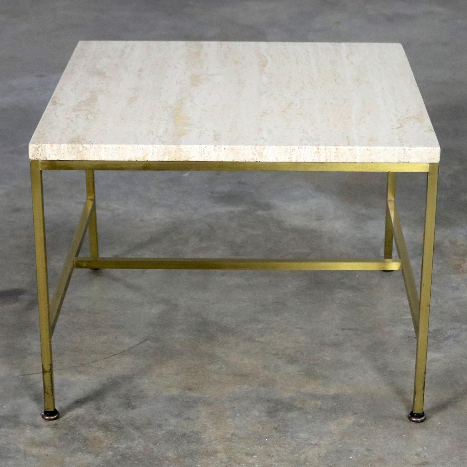 Handsome square side, end, or occasional table by Paul McCobb for Directional. With brass frame and travertine top. It is in wonderful original condition. The travertine is in wonderful condition apart from one small chip to one corner. We prefer to