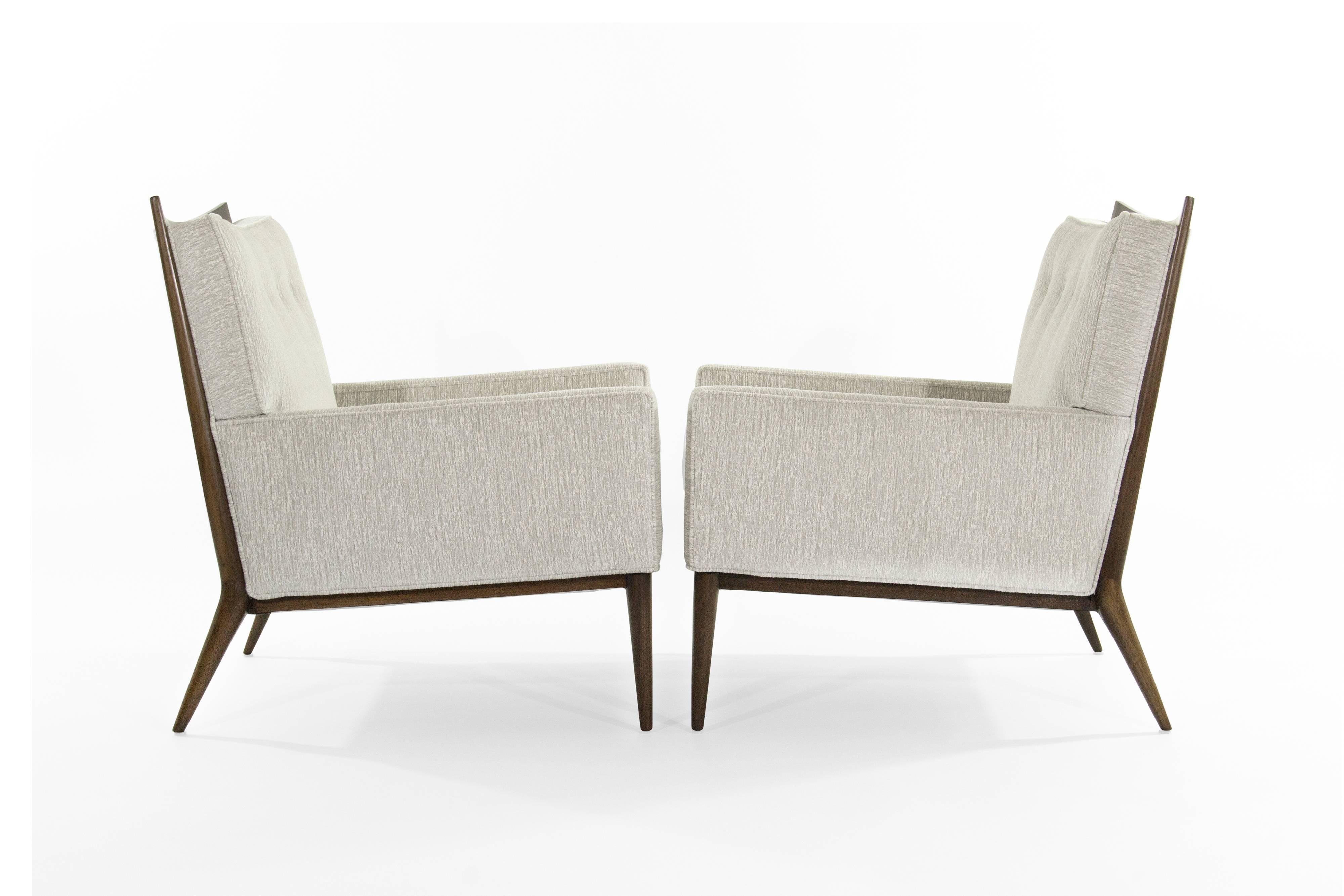 A set of lounge chairs designed by Paul McCobb for Directional, model 1322, circa 1950s.

Walnut frame fully restored, newly upholstered in light grey chenille by James Huniford.