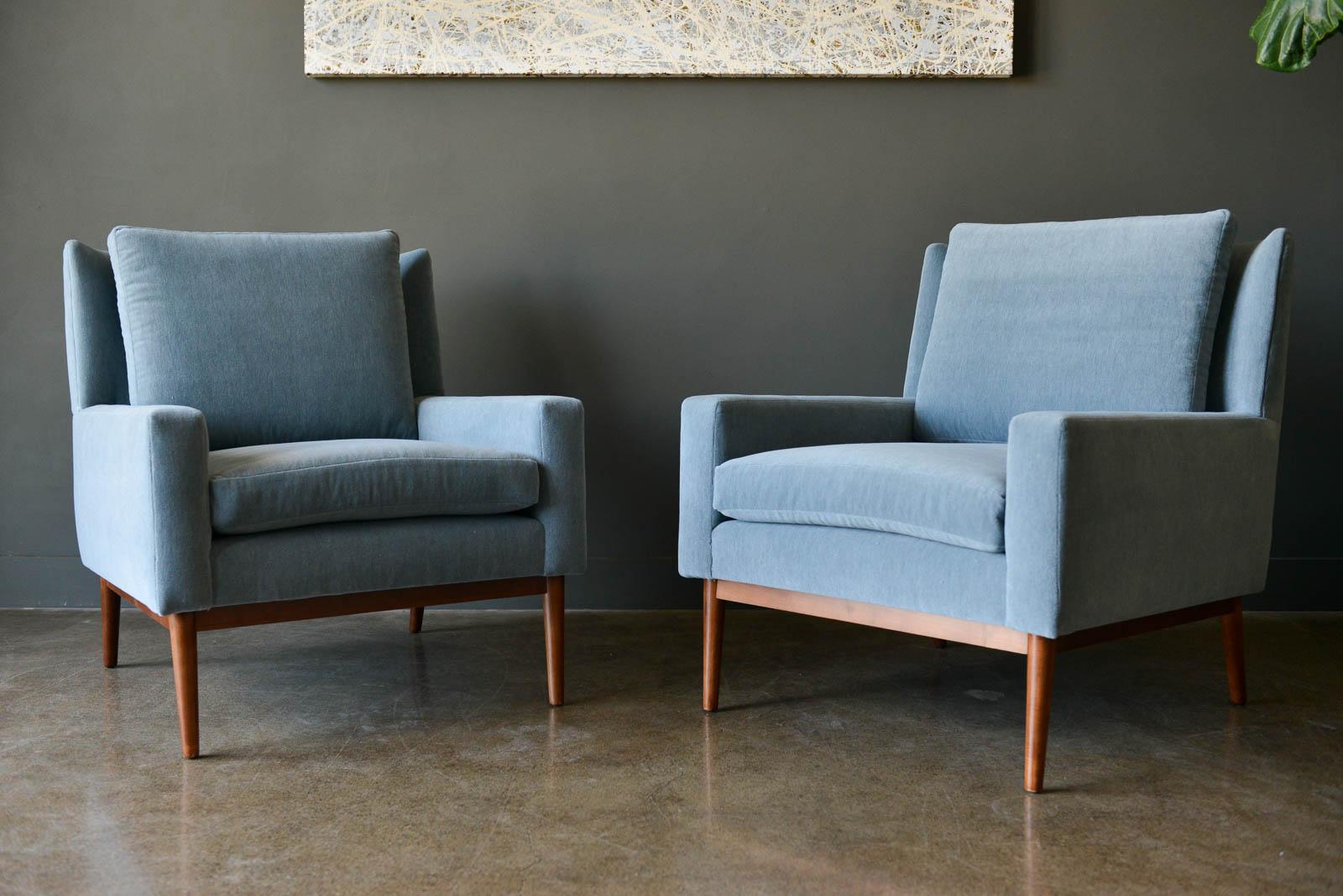 Paul McCobb for Directional lounge chairs, Model 302, ca. 1955. Professionally restored wood and new cushions and foam. These chairs have been thoughtfully restored and covered in luxurious Holland and Sherry Melange Wool Velvet Mohair, made in