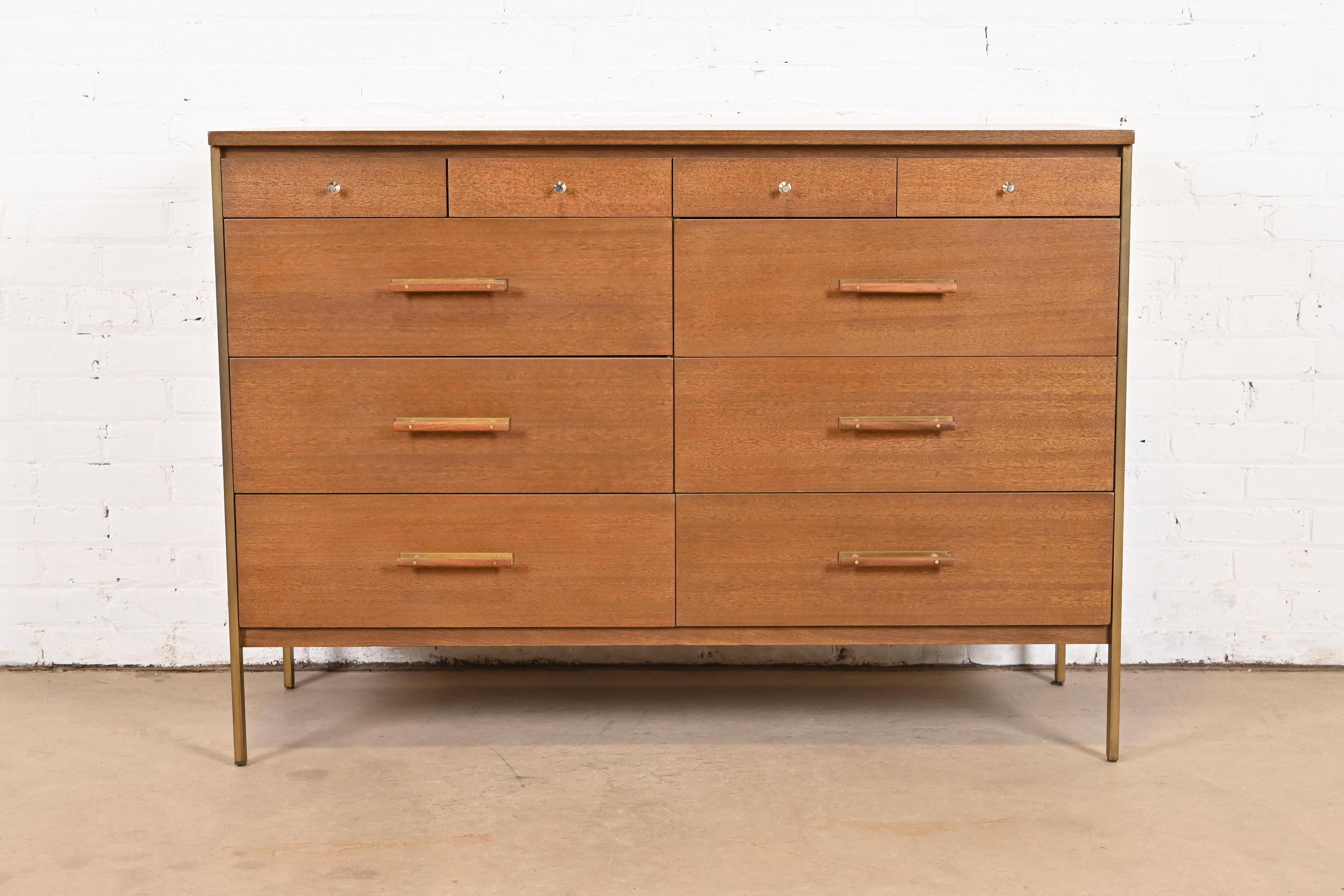 An exceptional Mid-Century Modern 10-drawer dresser or chest of drawers

By Paul McCobb for Directional and produced by Calvin Furniture

USA, 1950s

Beautiful Honduran mahogany, with brass legs and hardware.

Measures: 48