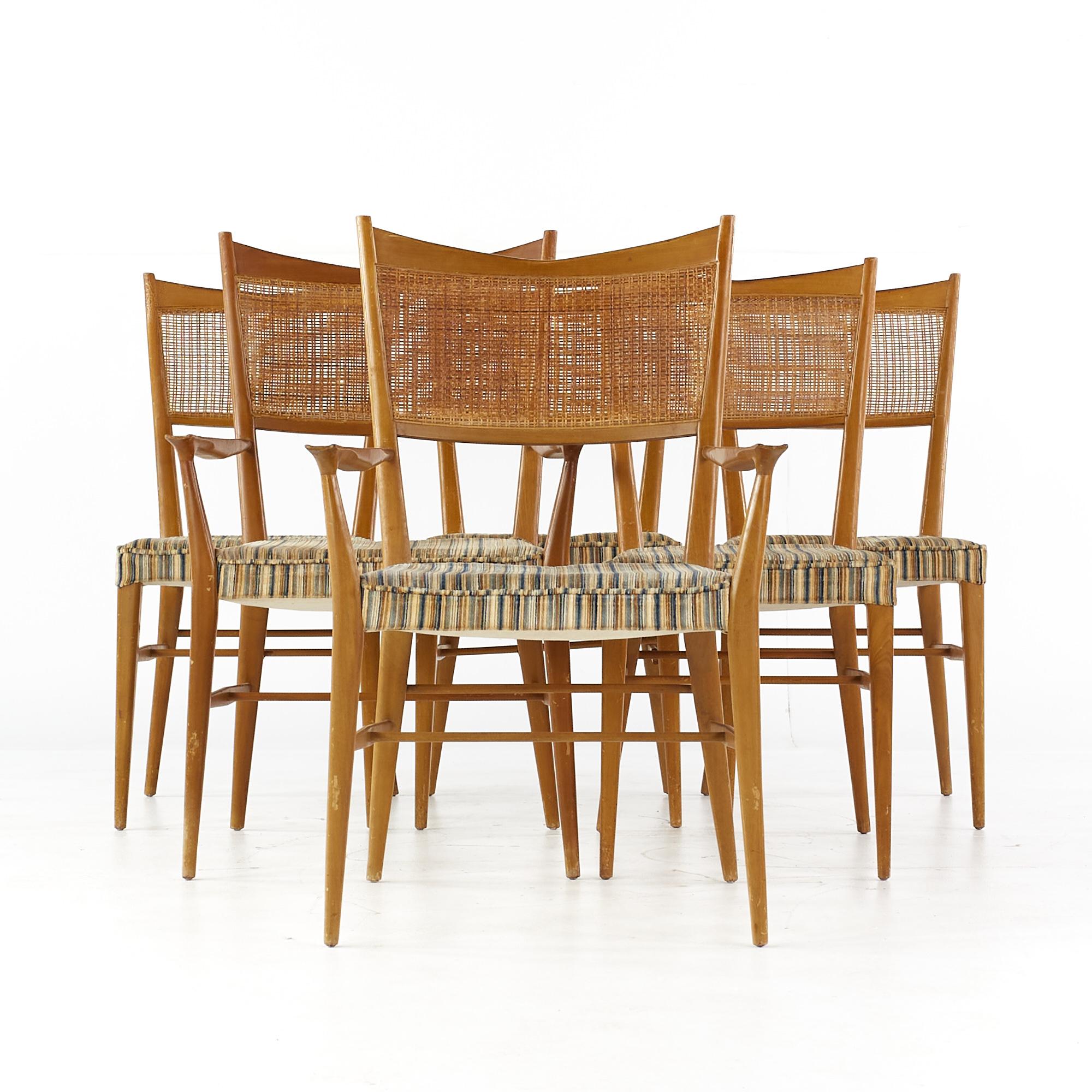 Paul McCobb for Directional Mid Century walnut and cane dining chairs - set of 6

Each armless chair measures: 16.5 wide x 16.5 deep x 34.5 high, with a seat height of 17.25 inches
Each captains chair measures: 23 wide x 20 deep x 36 high, with a