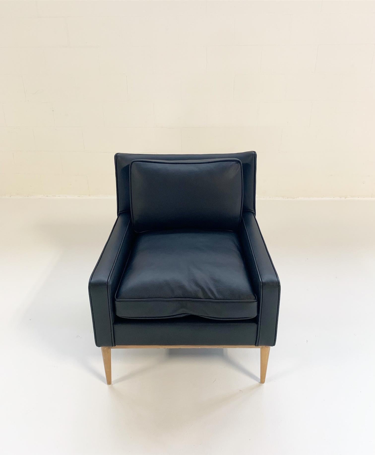 Paul McCobb's modern take on traditional pieces makes him a favorite among American mid-century designers. Completely restored and masterfully reupholstered in the most luxurious leather from renowned Italian label, Loro Piana, this McCobb lounge